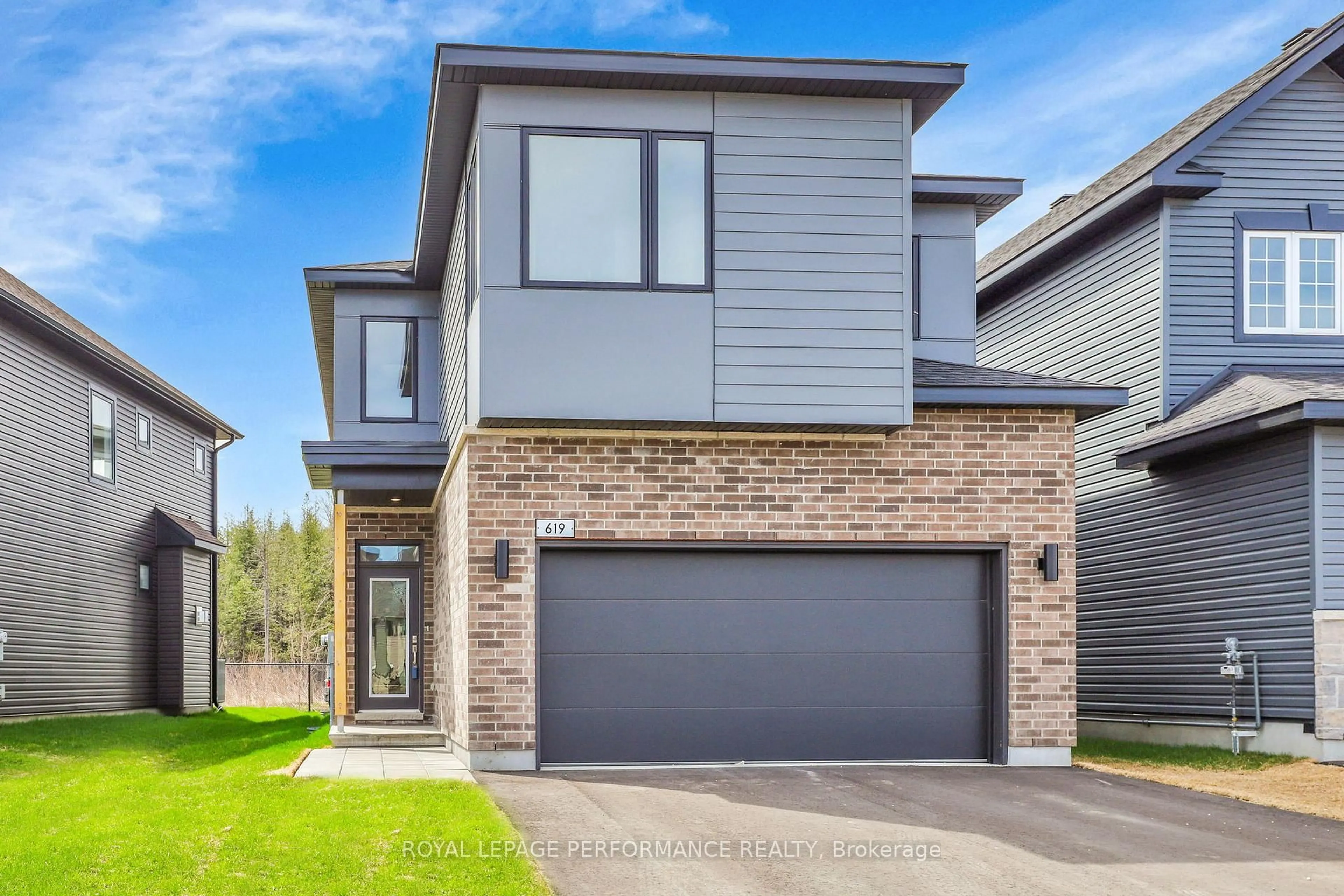 Home with brick exterior material, street for 619 Paakanaak Ave, Ottawa Ontario K1X 0J6