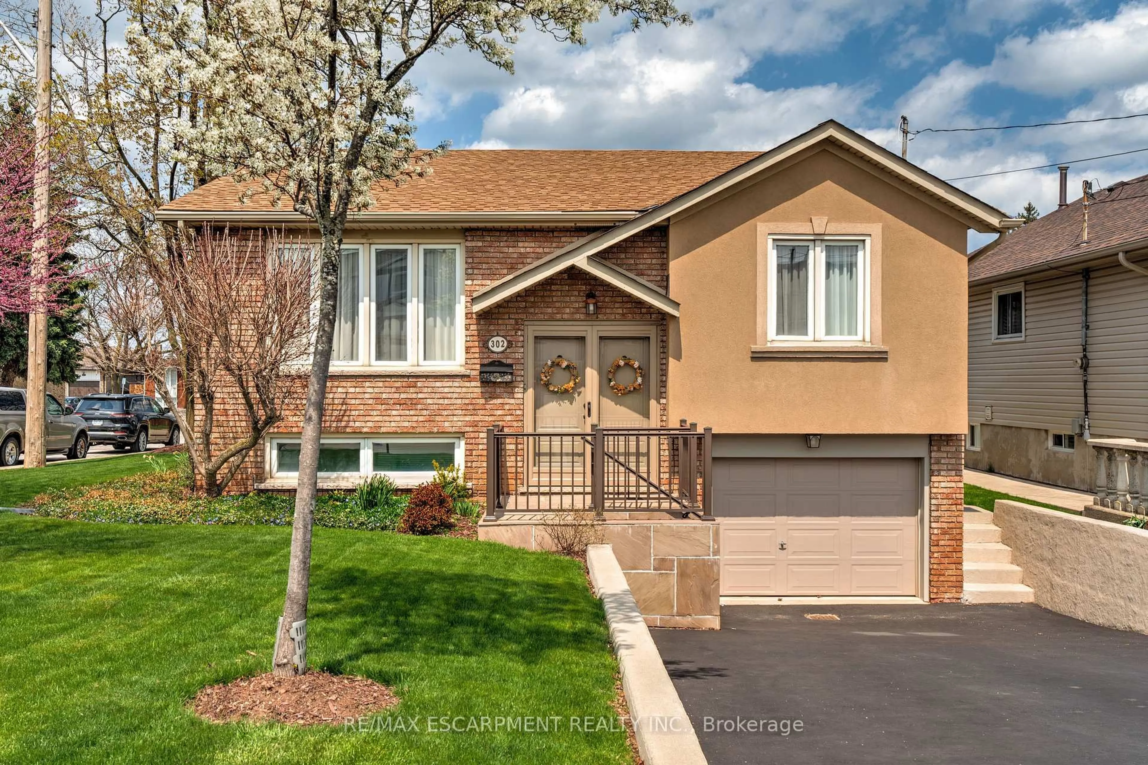 Home with brick exterior material, street for 302 Highridge Ave, Hamilton Ontario L8E 3W3