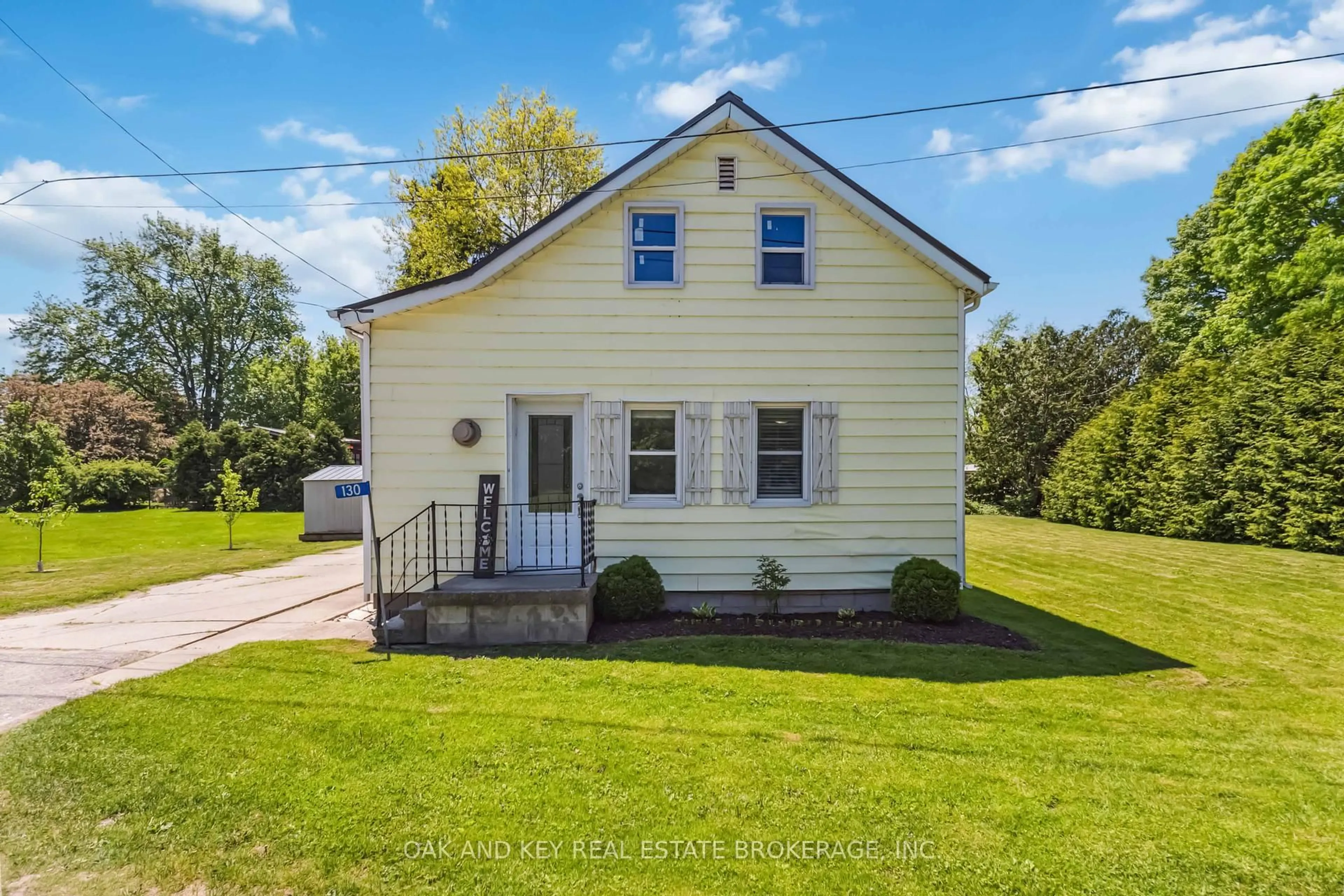 Home with vinyl exterior material, street for 130 Wellington St, Southwest Middlesex Ontario N0L 2N0