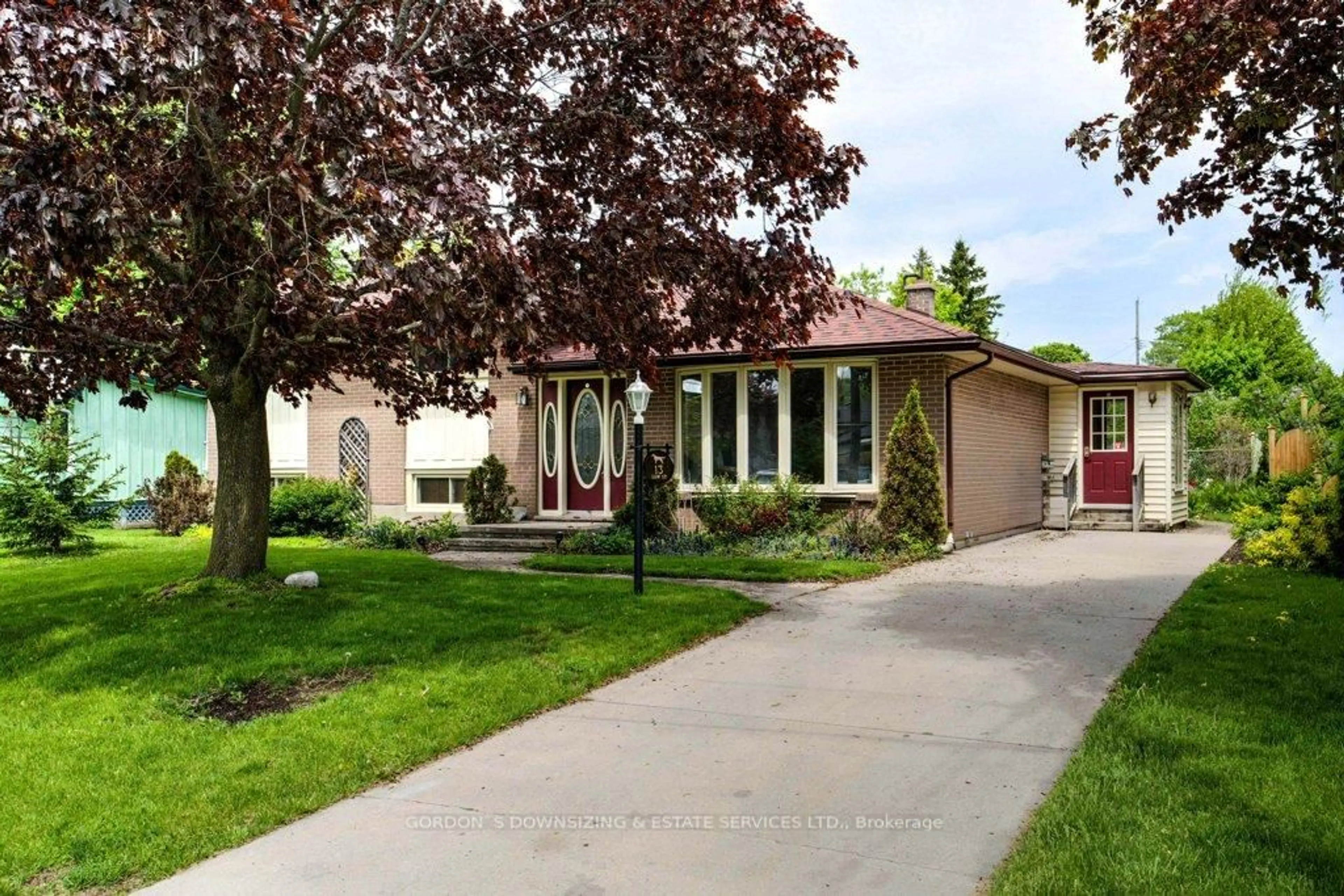 Home with vinyl exterior material, street for 13 Low St, Prince Edward County Ontario K0K 2T0