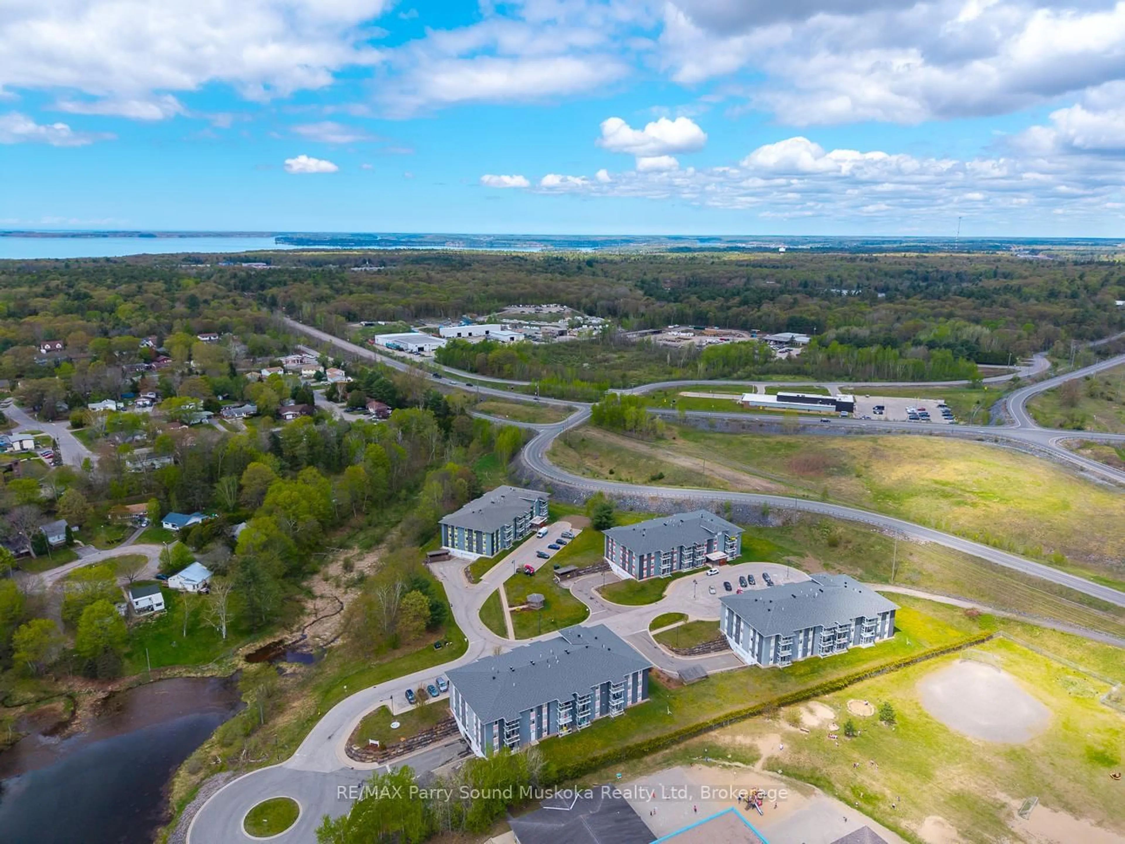 A pic from outside/outdoor area/front of a property/back of a property/a pic from drone, water/lake/river/ocean view for 20 Silver Birch Crt #304, Parry Sound Ontario P2A 0A7