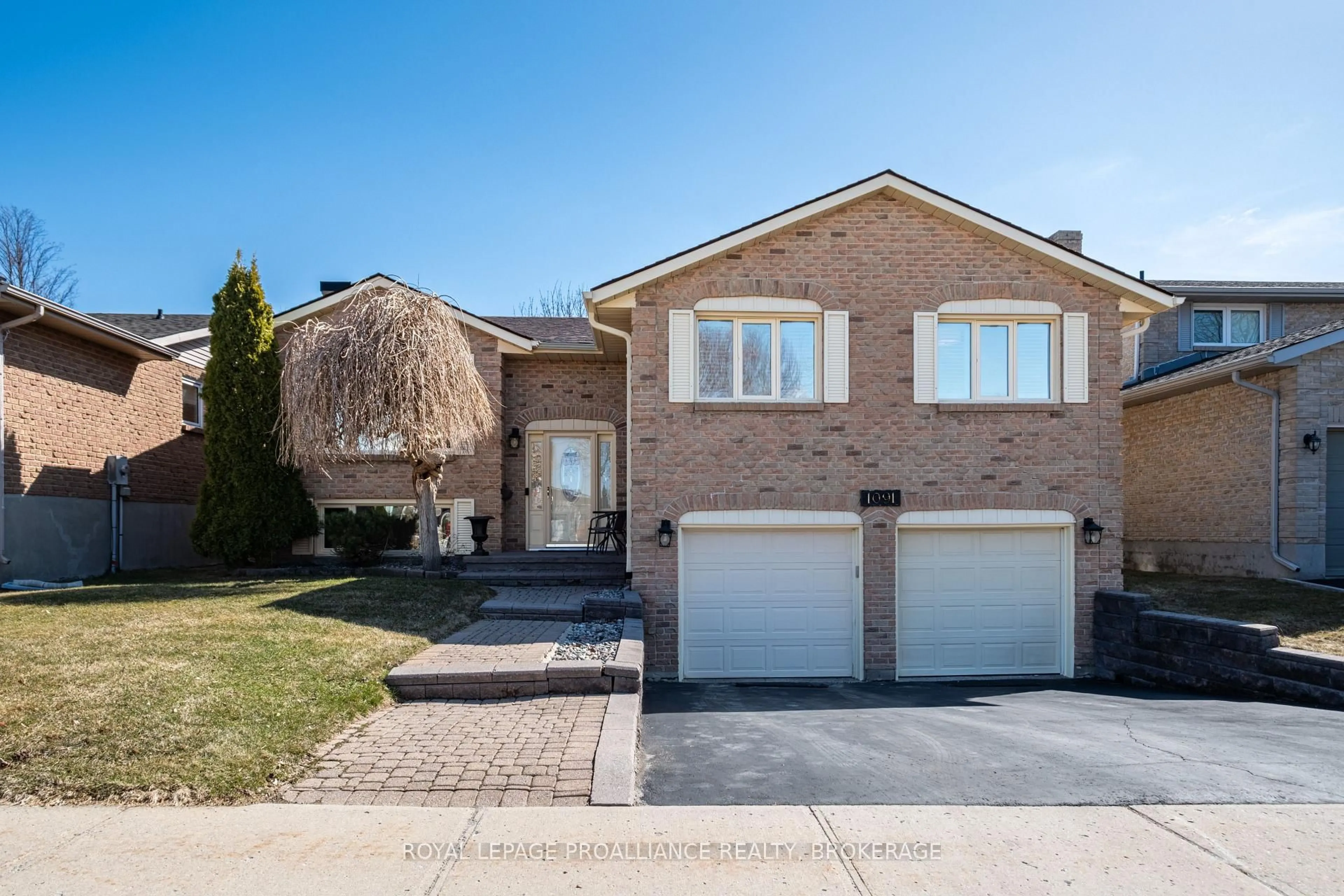 Home with brick exterior material, street for 1091 Palmerston Cres, Kingston Ontario K7P 2P5