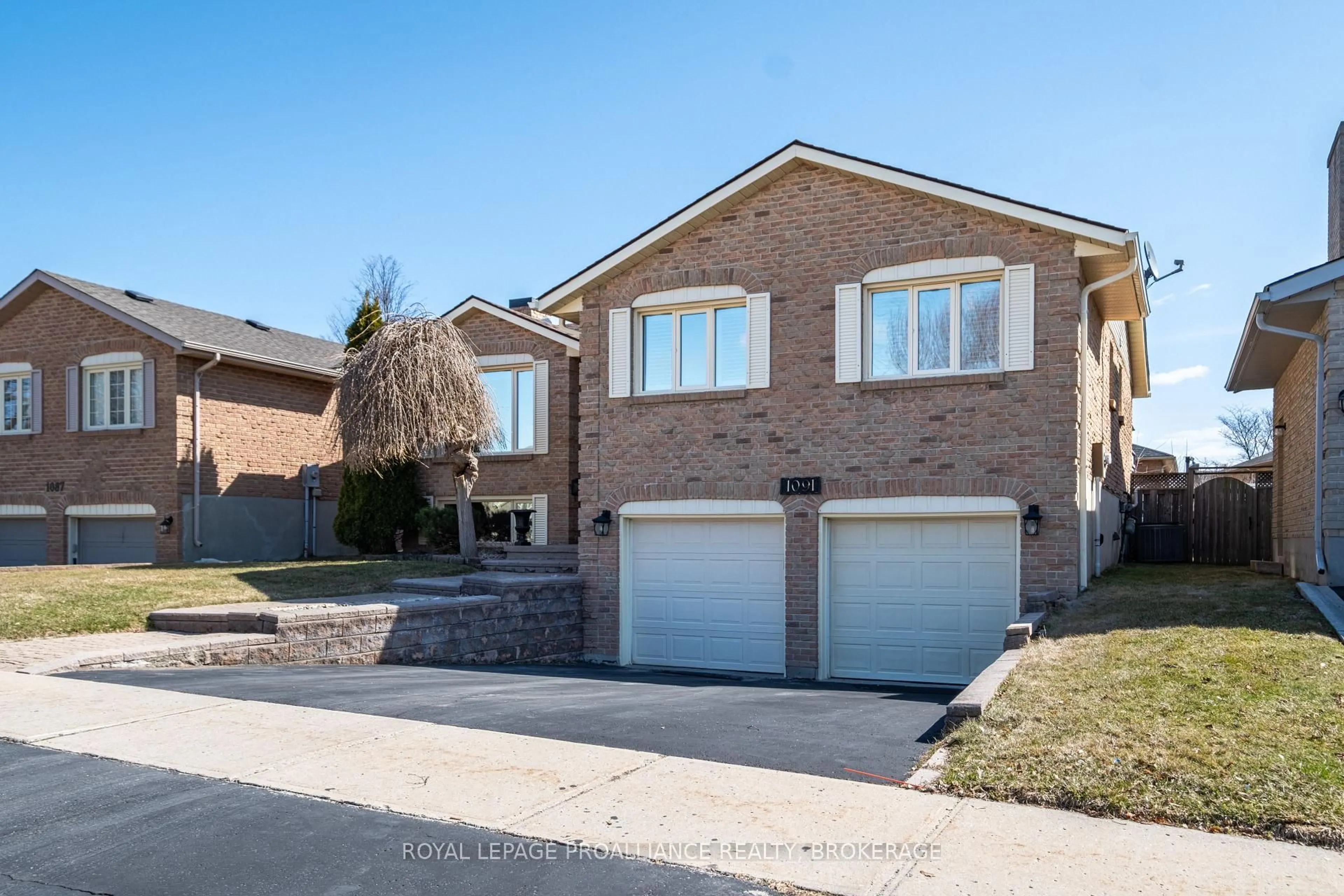 Home with brick exterior material, street for 1091 Palmerston Cres, Kingston Ontario K7P 2P5