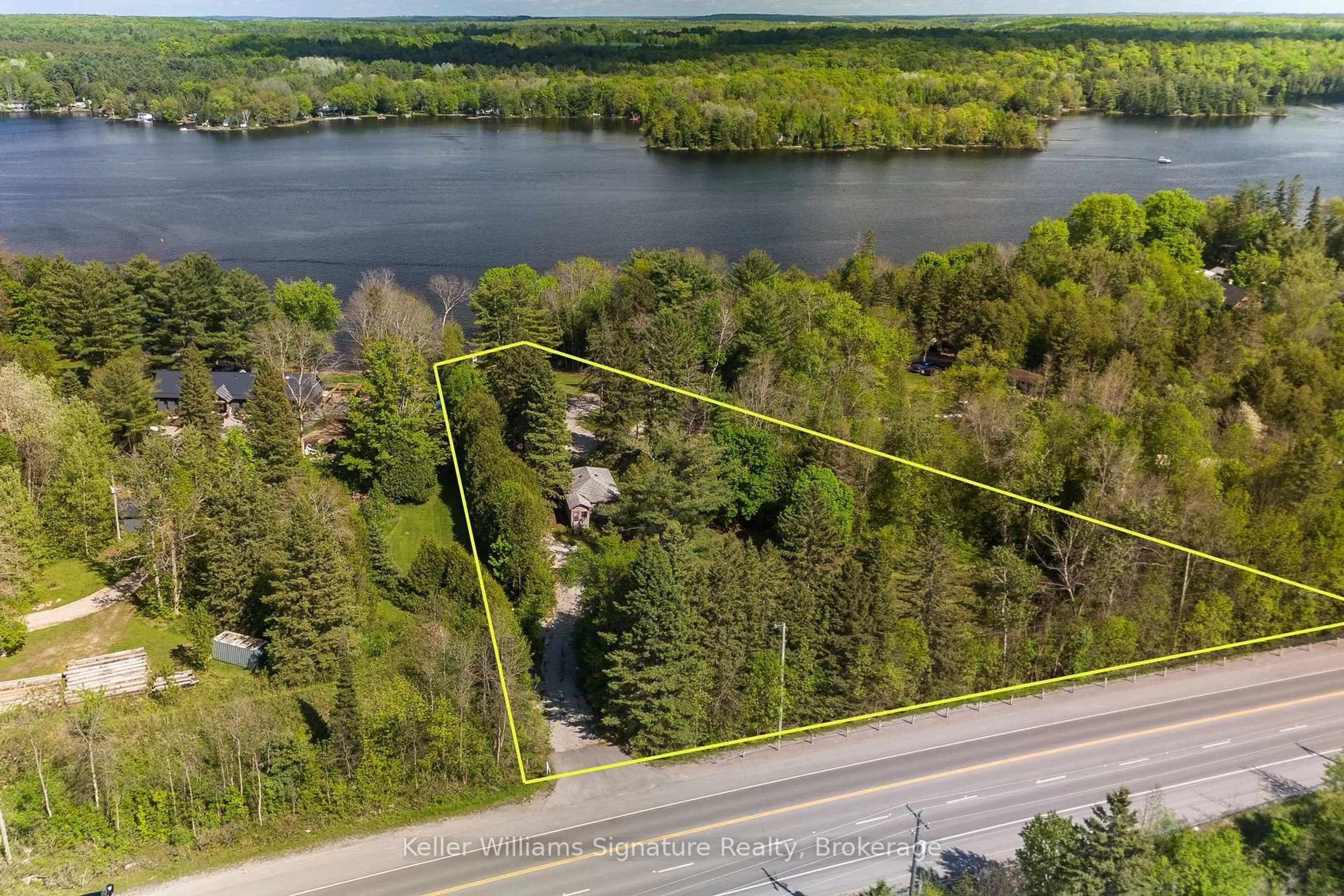 A pic from outside/outdoor area/front of a property/back of a property/a pic from drone, water/lake/river/ocean view for 7296 Hwy 35, Kawartha Lakes Ontario K0M 1K0