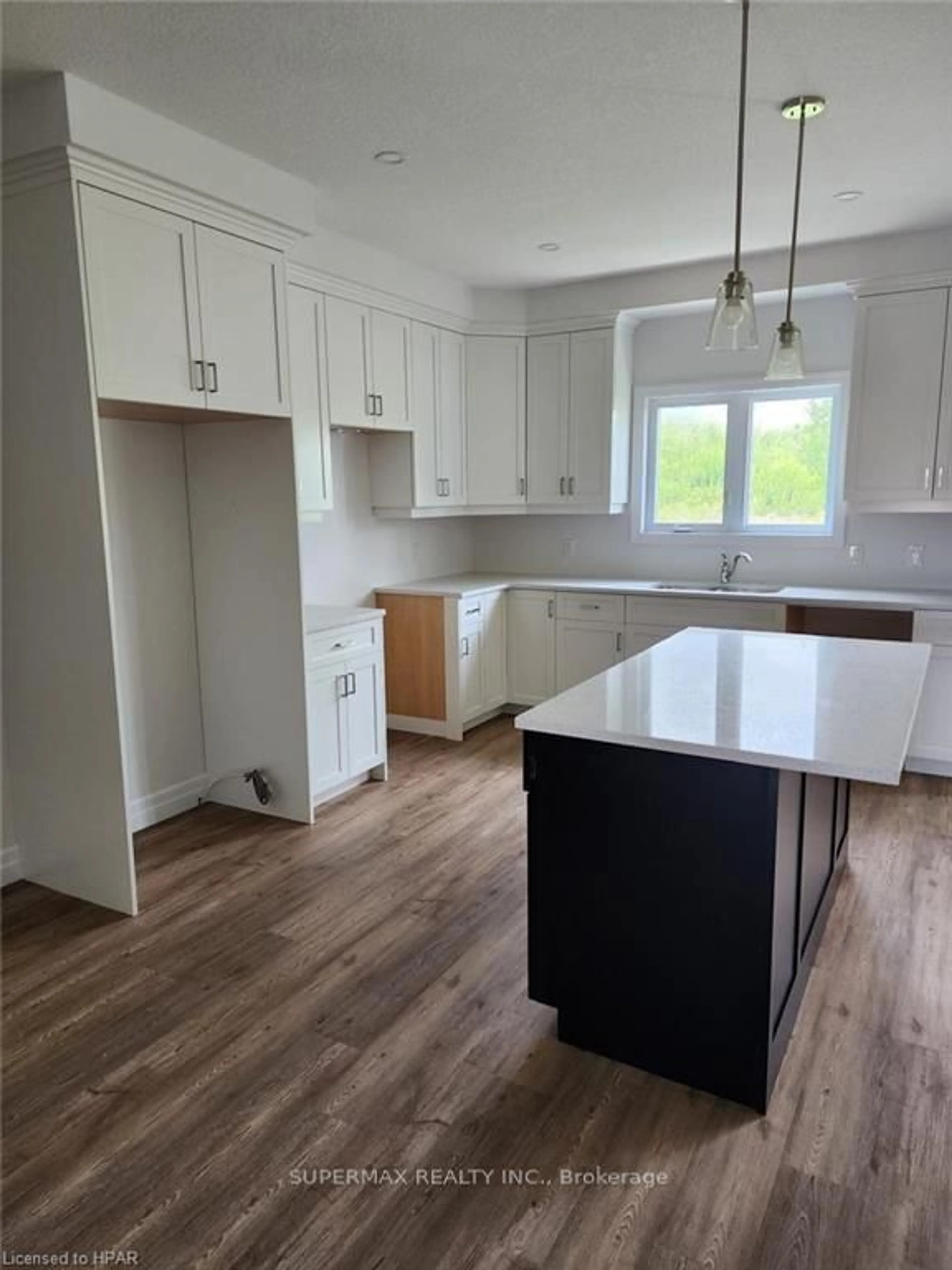 Open concept kitchen, wood/laminate floor for 624 Wray Ave, North Perth Ontario N4W 0J9