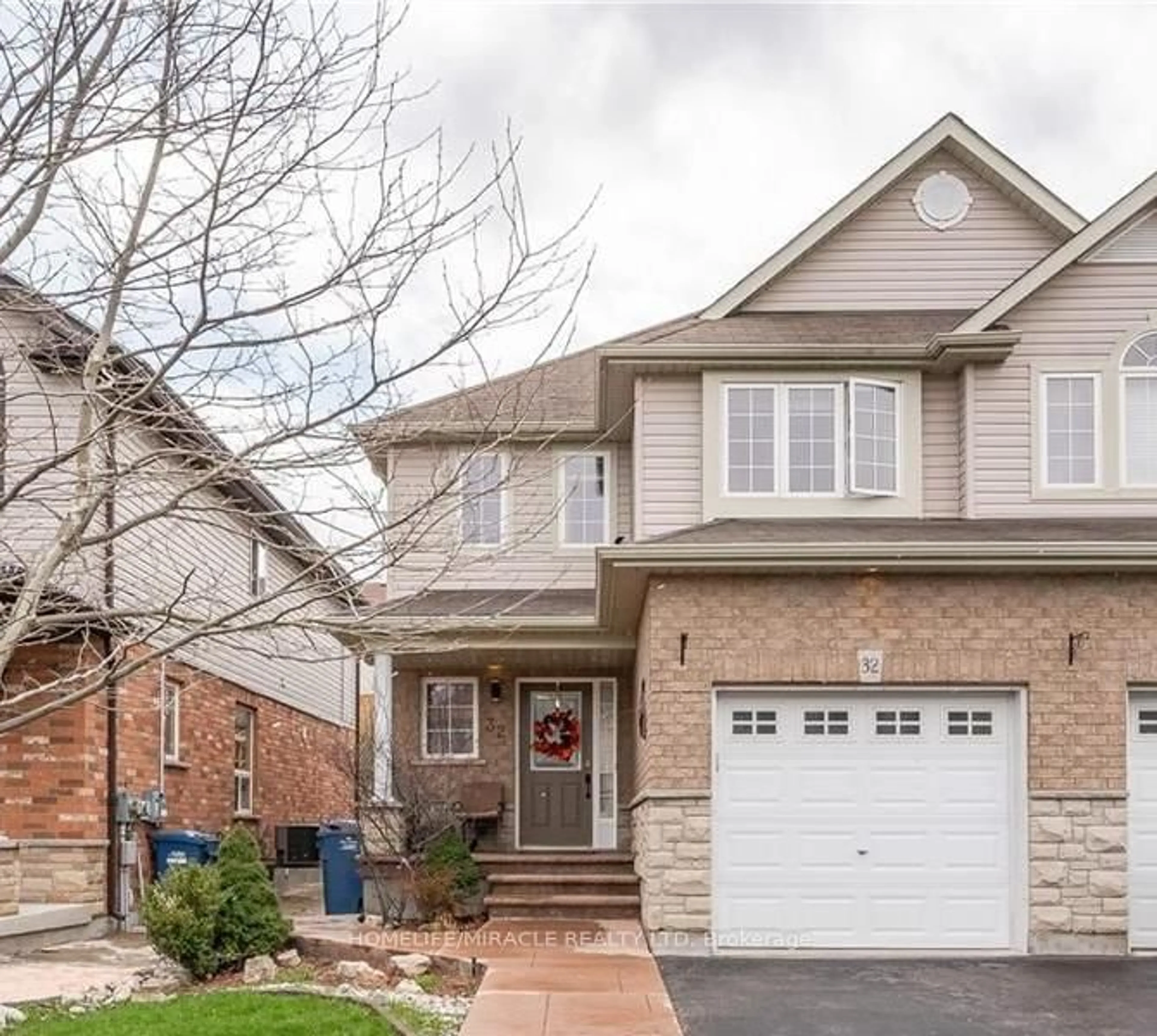 Home with brick exterior material, street for 32 Vipond St, Guelph Ontario N1E 0H3