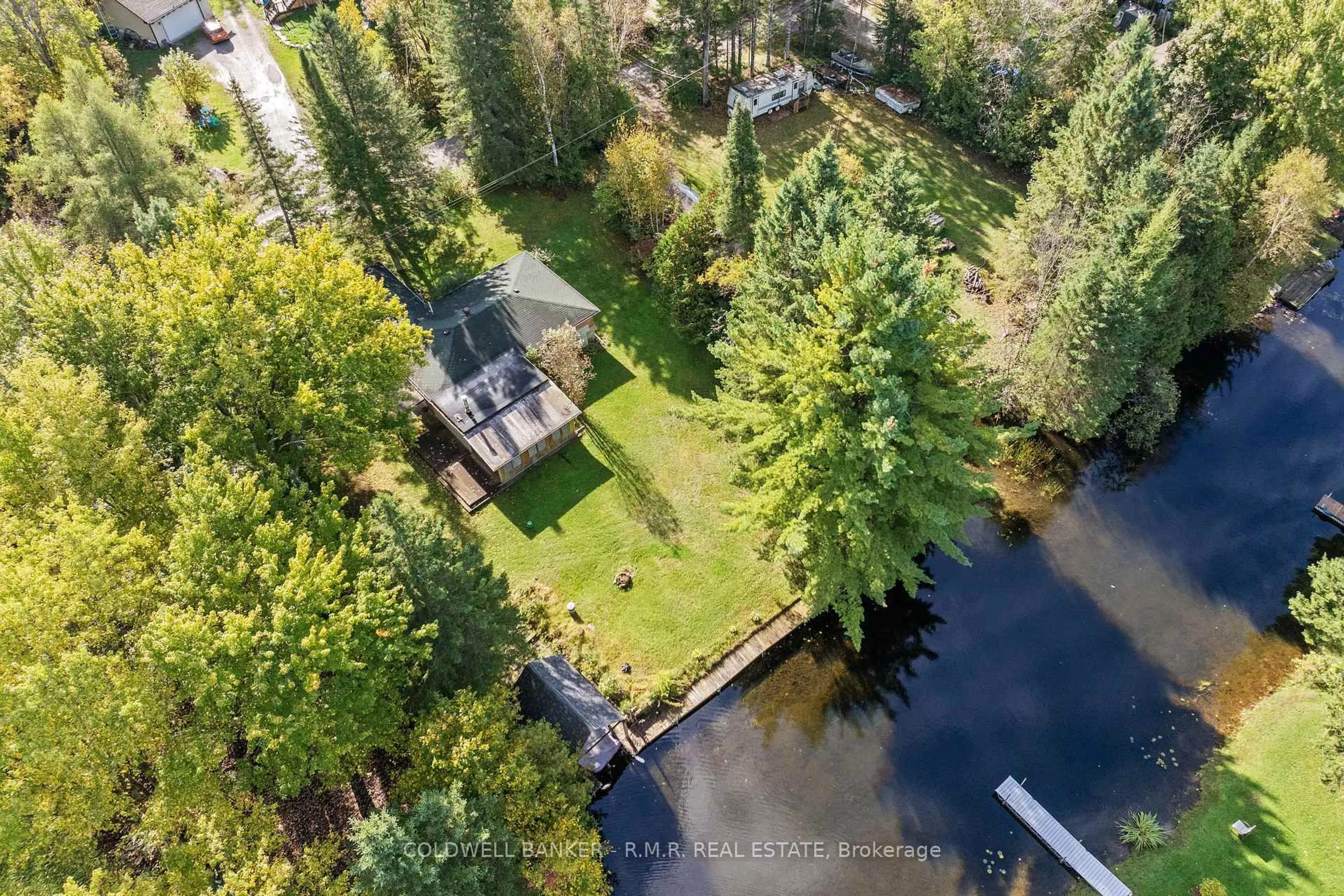 A pic from outside/outdoor area/front of a property/back of a property/a pic from drone, water/lake/river/ocean view for 57 Fire Route 104, Trent Lakes Ontario K0M 1A0