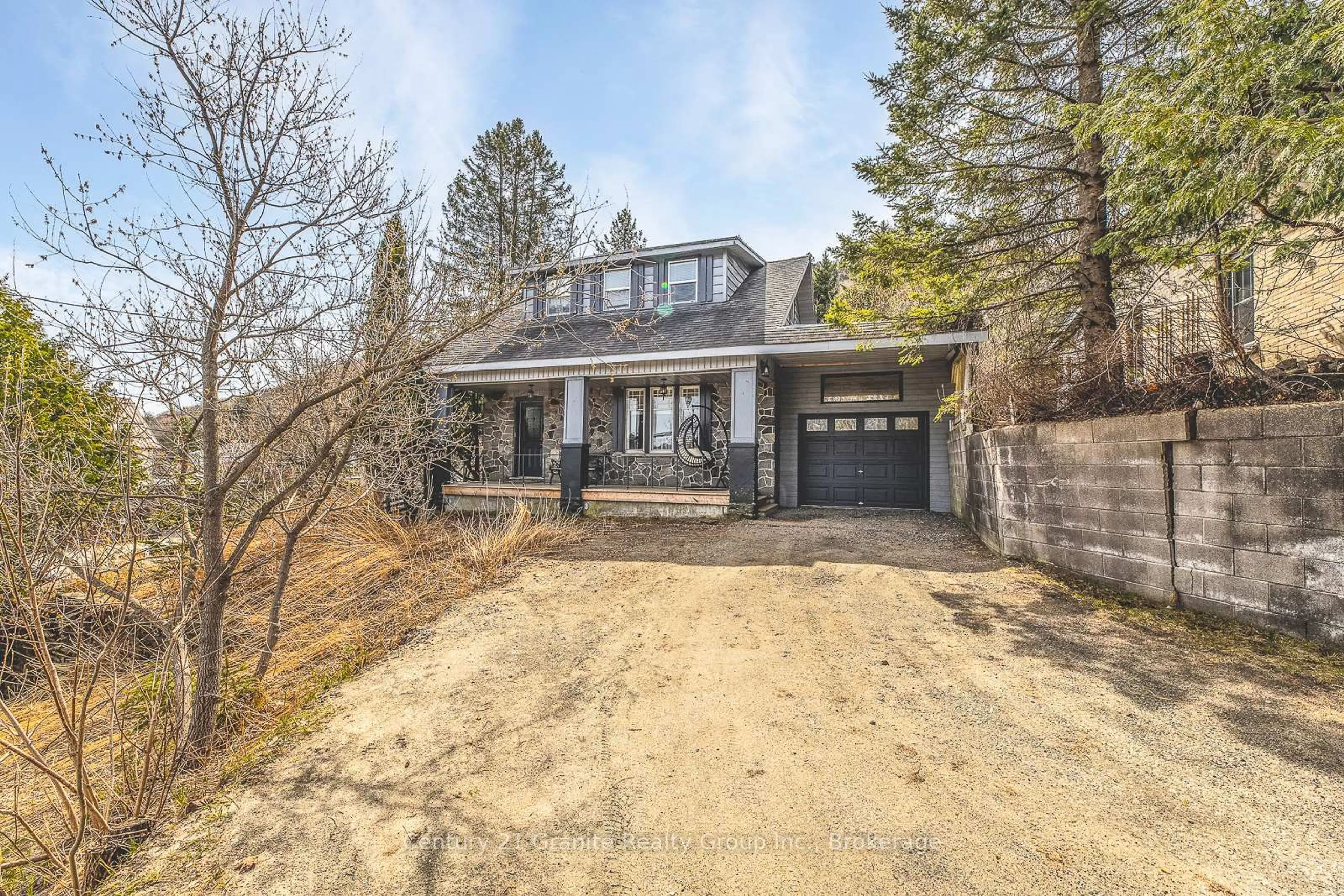 A pic from outside/outdoor area/front of a property/back of a property/a pic from drone, street for 690 Mountain St, Dysart et al Ontario K0M 1S0