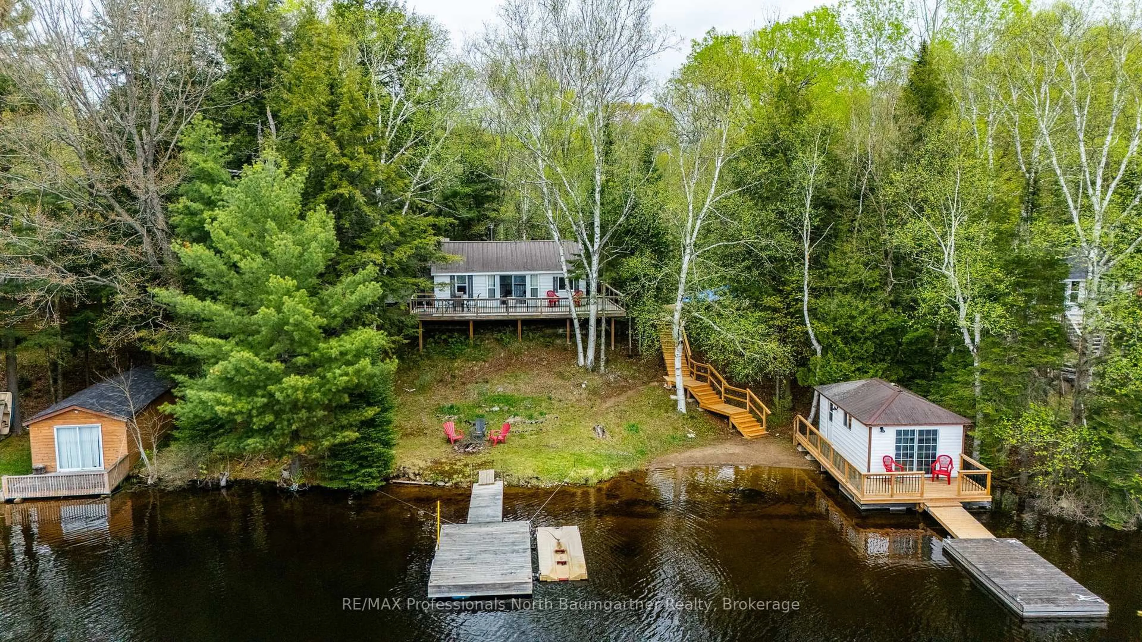 A pic from outside/outdoor area/front of a property/back of a property/a pic from drone, water/lake/river/ocean view for 1004 Wilson Heights Tr, Dysart et al Ontario K0M 1S0