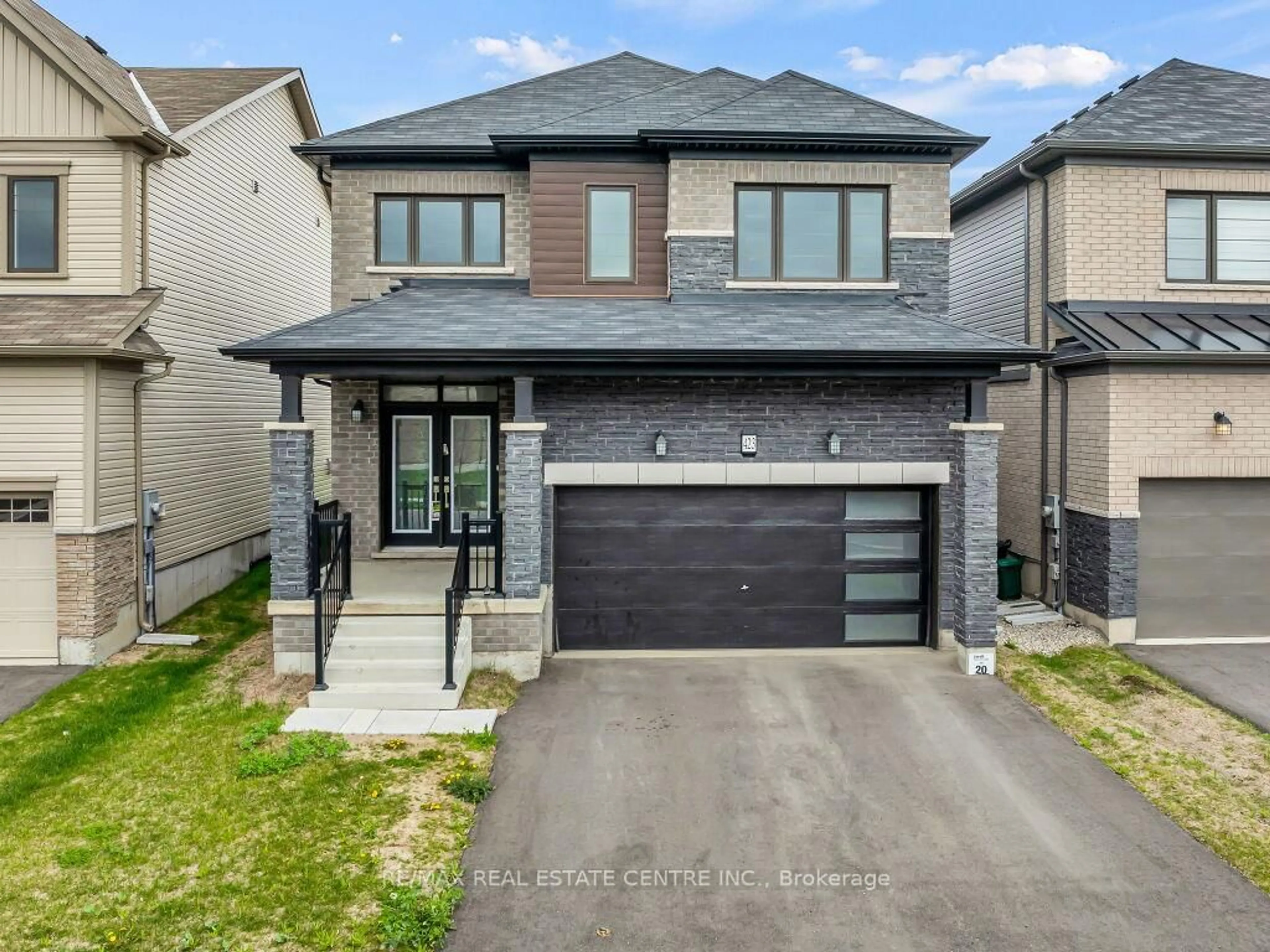 Home with brick exterior material, street for 423 Dolman St, Woolwich Ontario N0B 1M0