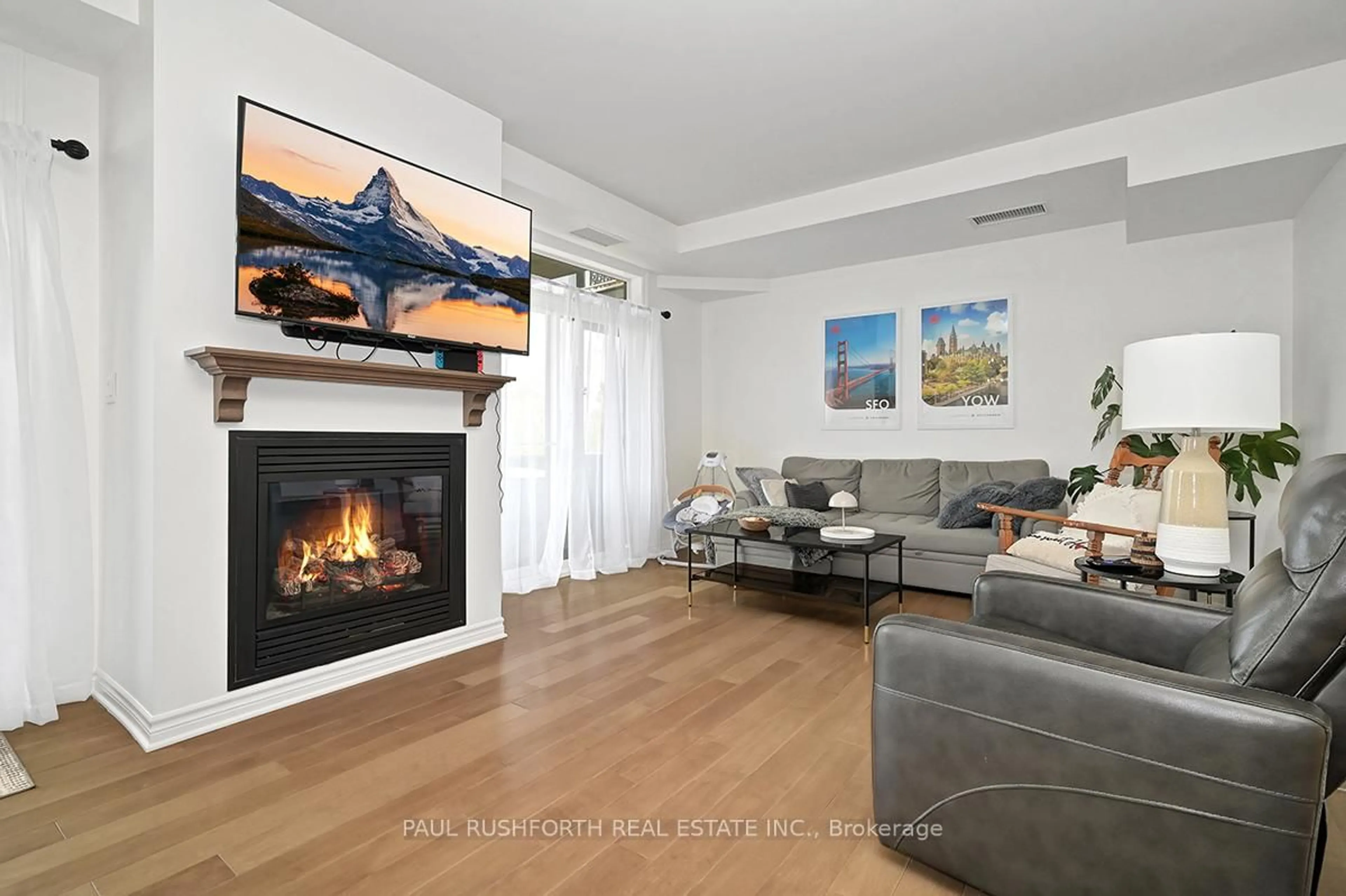 Living room with furniture, wood/laminate floor for 50 Prestige Circ #4, Ottawa Ontario K4A 0W9