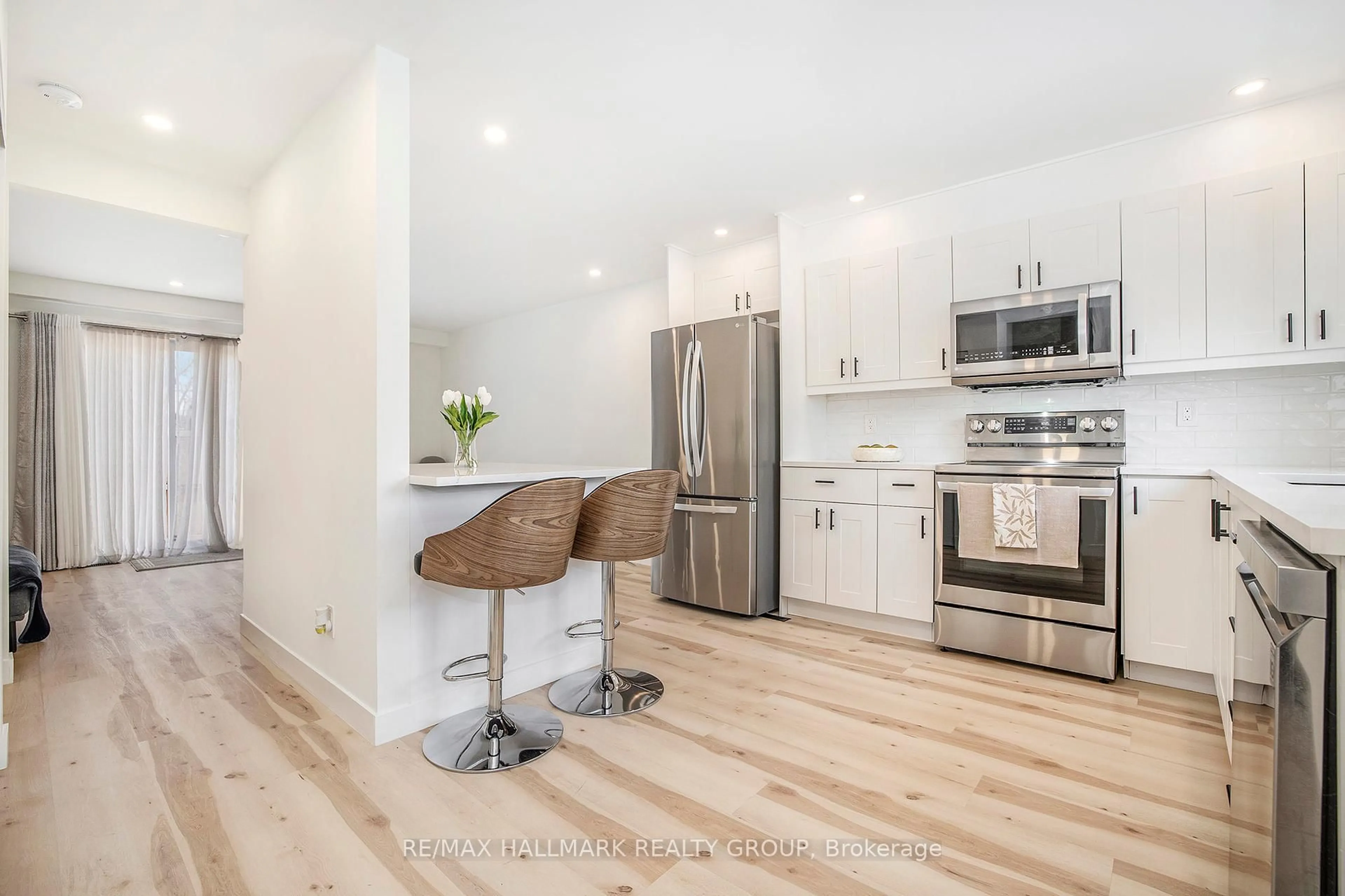 Open concept kitchen, wood/laminate floor for 97 Pickford Dr, Ottawa Ontario K2L 2C2