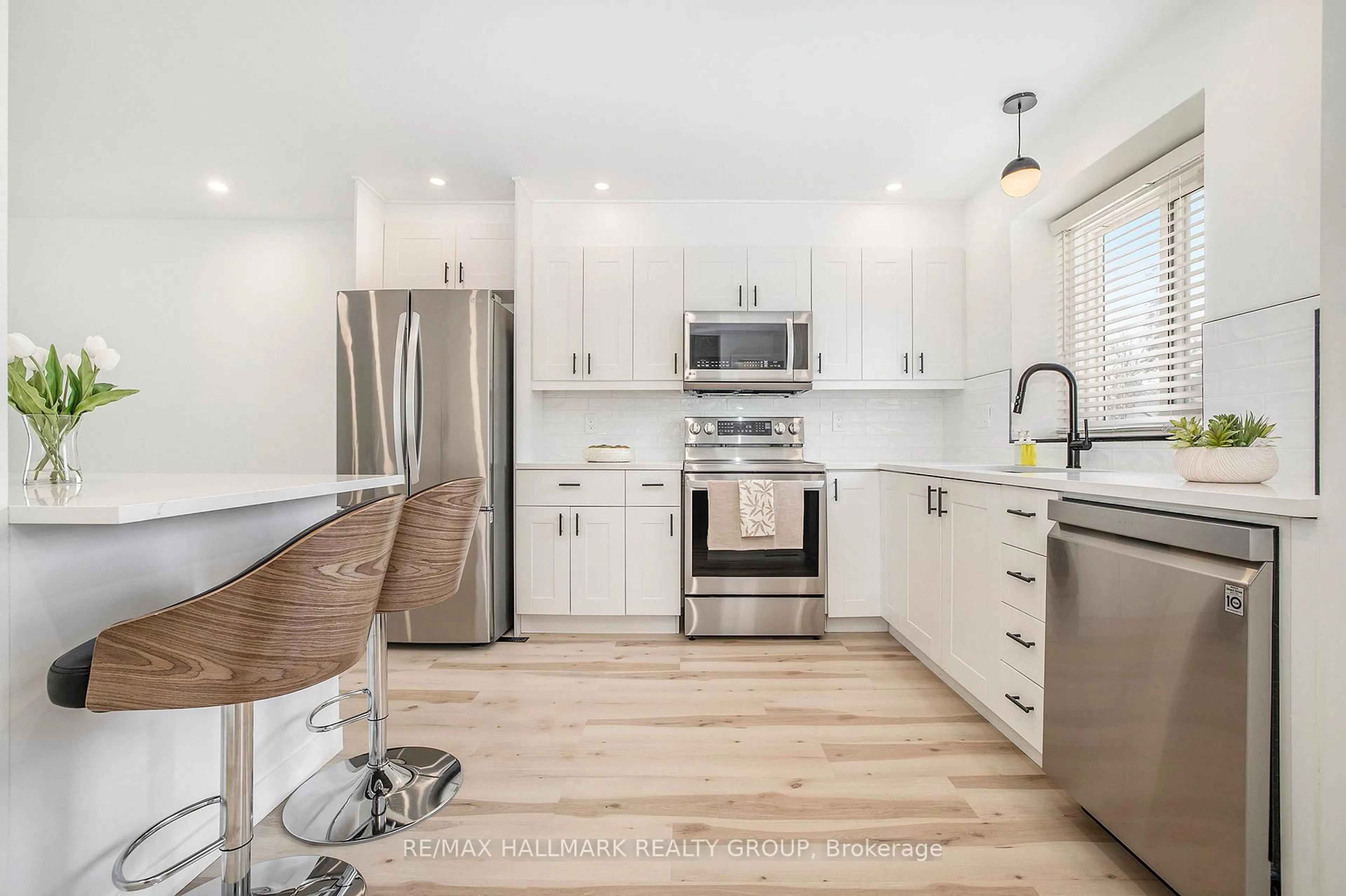 Open concept kitchen, wood/laminate floor for 97 Pickford Dr, Ottawa Ontario K2L 2C2