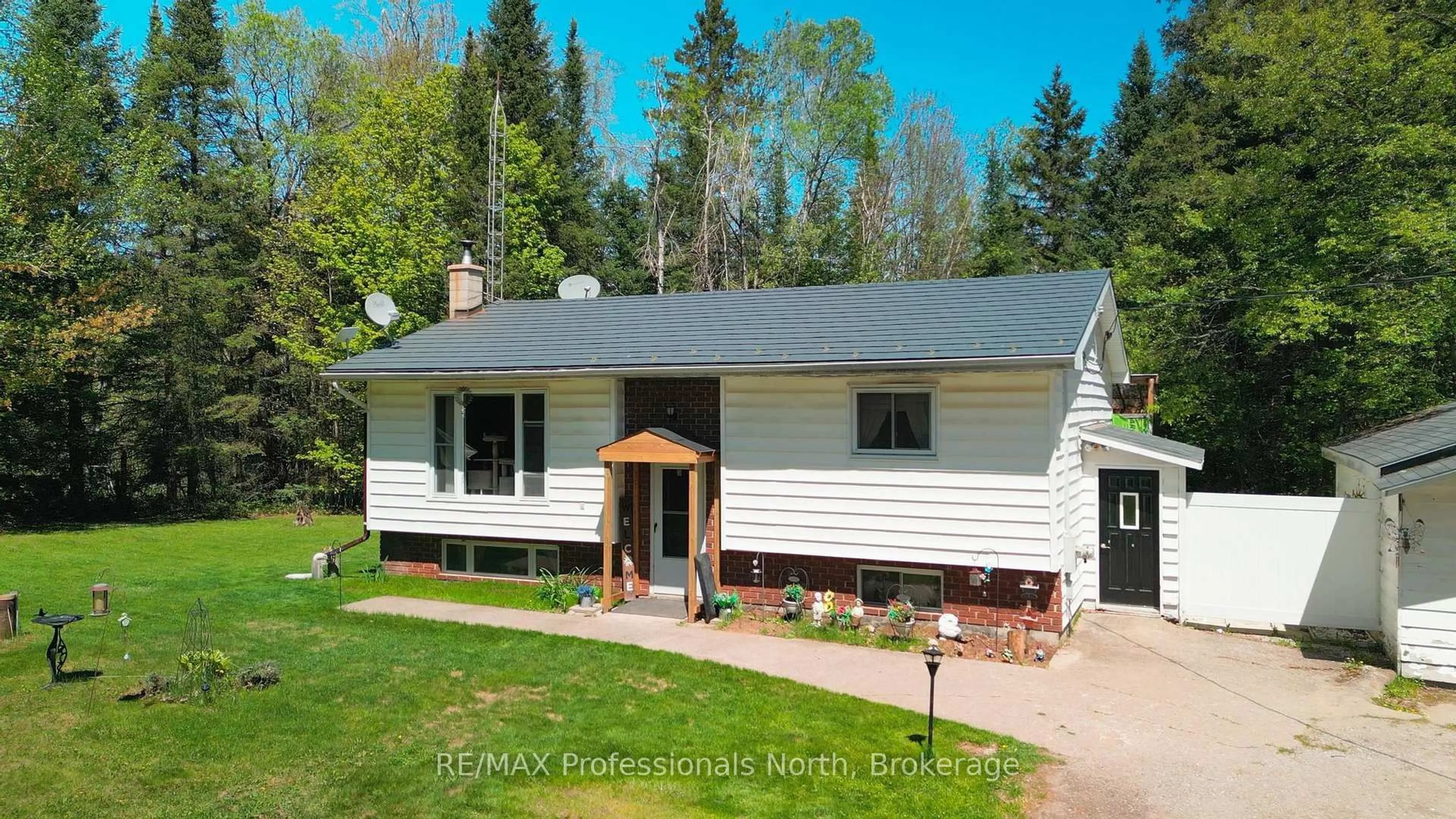 Home with vinyl exterior material, street for 1204 Bacon Rd, Minden Hills Ontario K0M 2K0