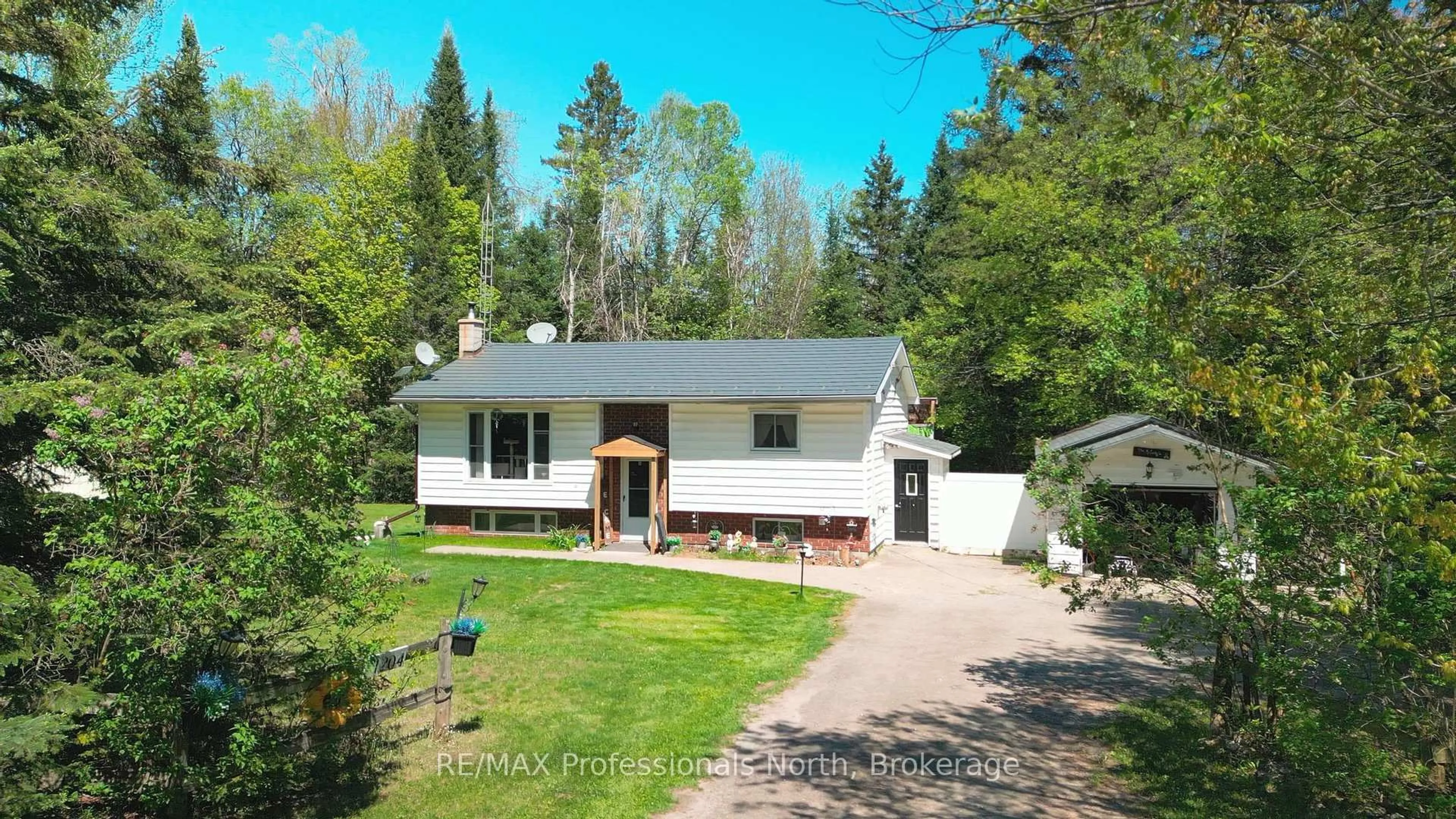 A pic from outside/outdoor area/front of a property/back of a property/a pic from drone, street for 1204 Bacon Rd, Minden Hills Ontario K0M 2K0