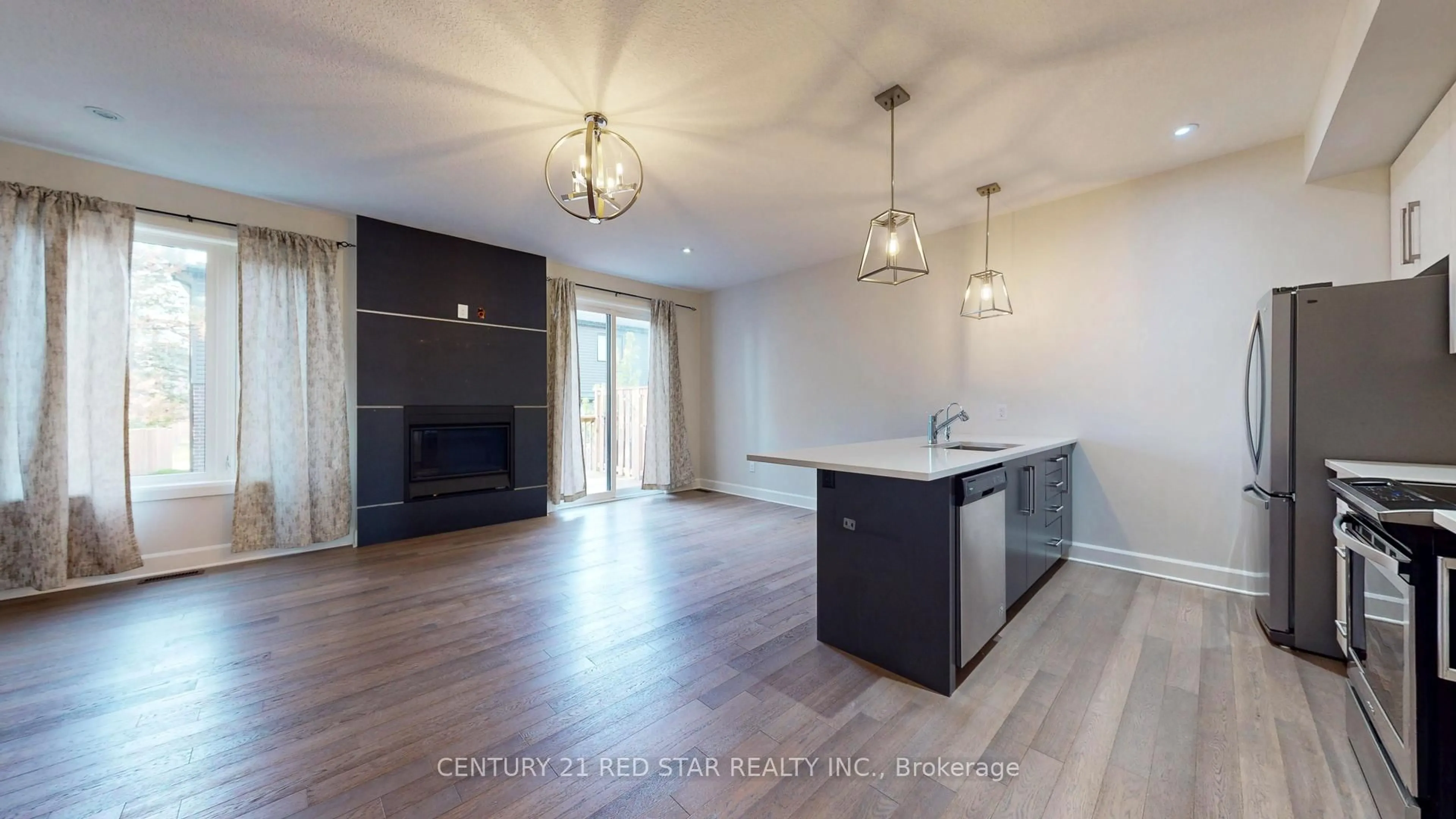 Open concept kitchen, wood/laminate floor for 499 Sophia Cres #32, London North Ontario N6G 5N9