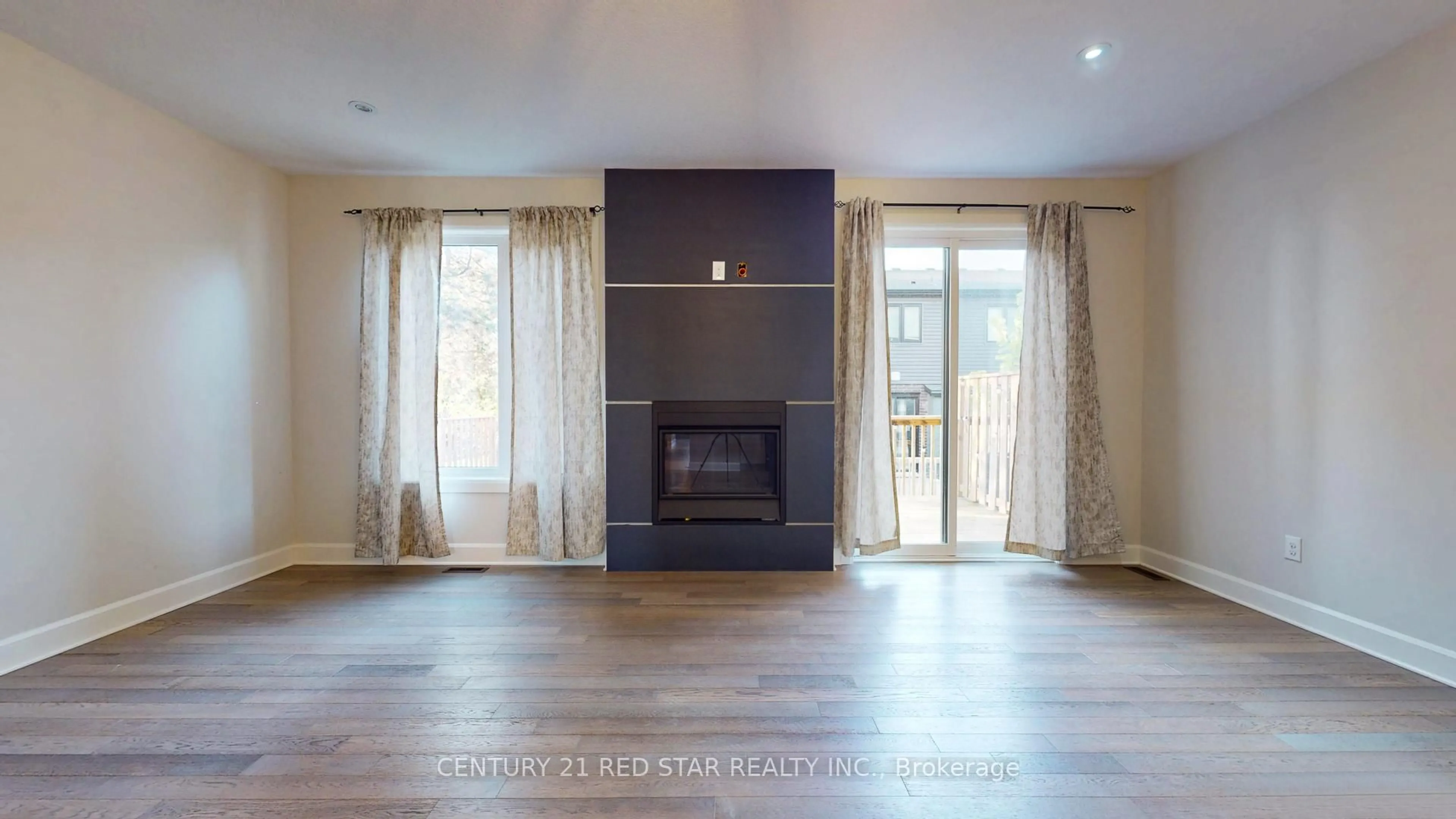 Living room with furniture, wood/laminate floor for 499 Sophia Cres #32, London North Ontario N6G 5N9