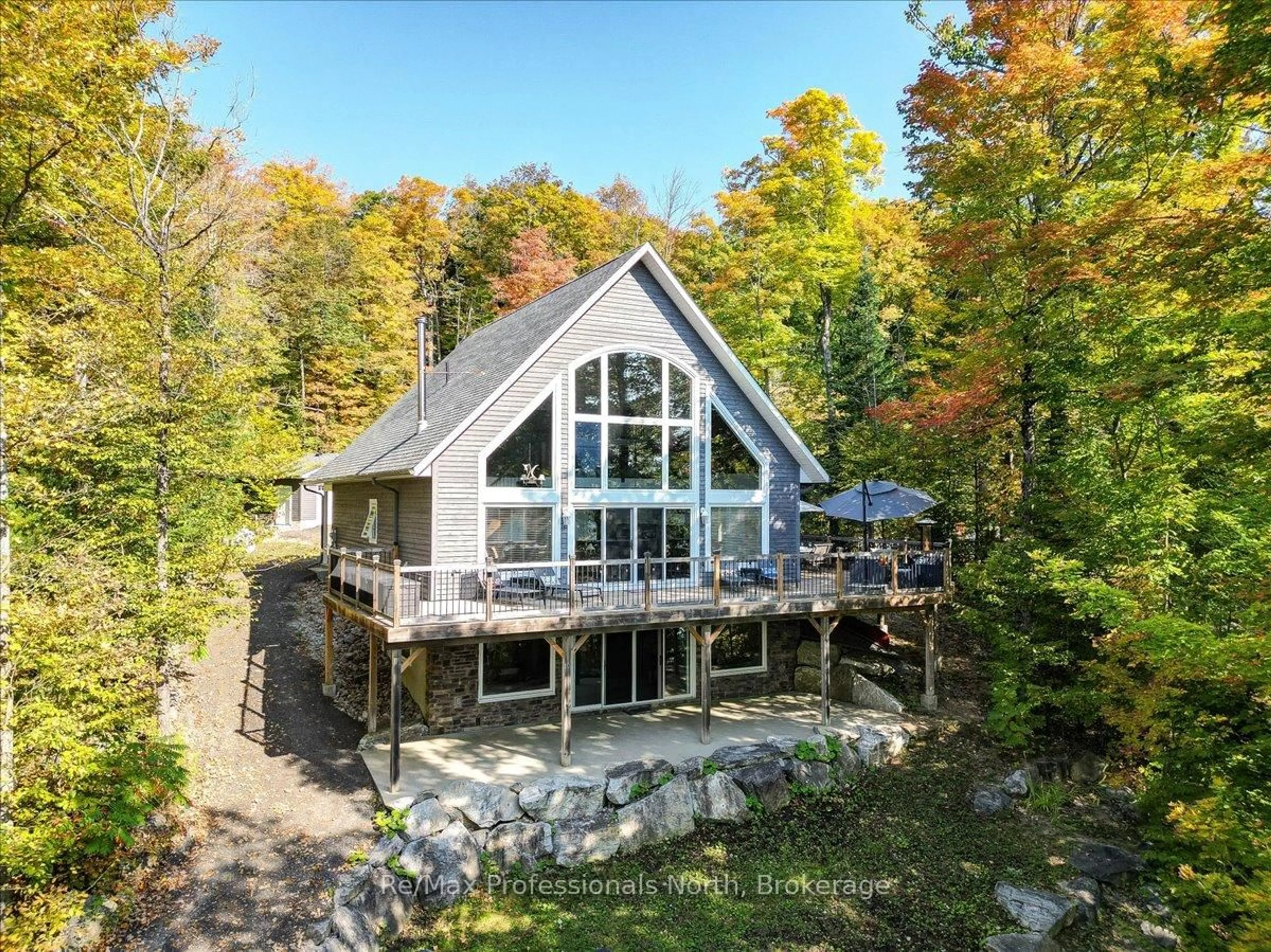 A pic from outside/outdoor area/front of a property/back of a property/a pic from drone, water/lake/river/ocean view for 88 Russell Dr, Trent Lakes Ontario K0M 2A0