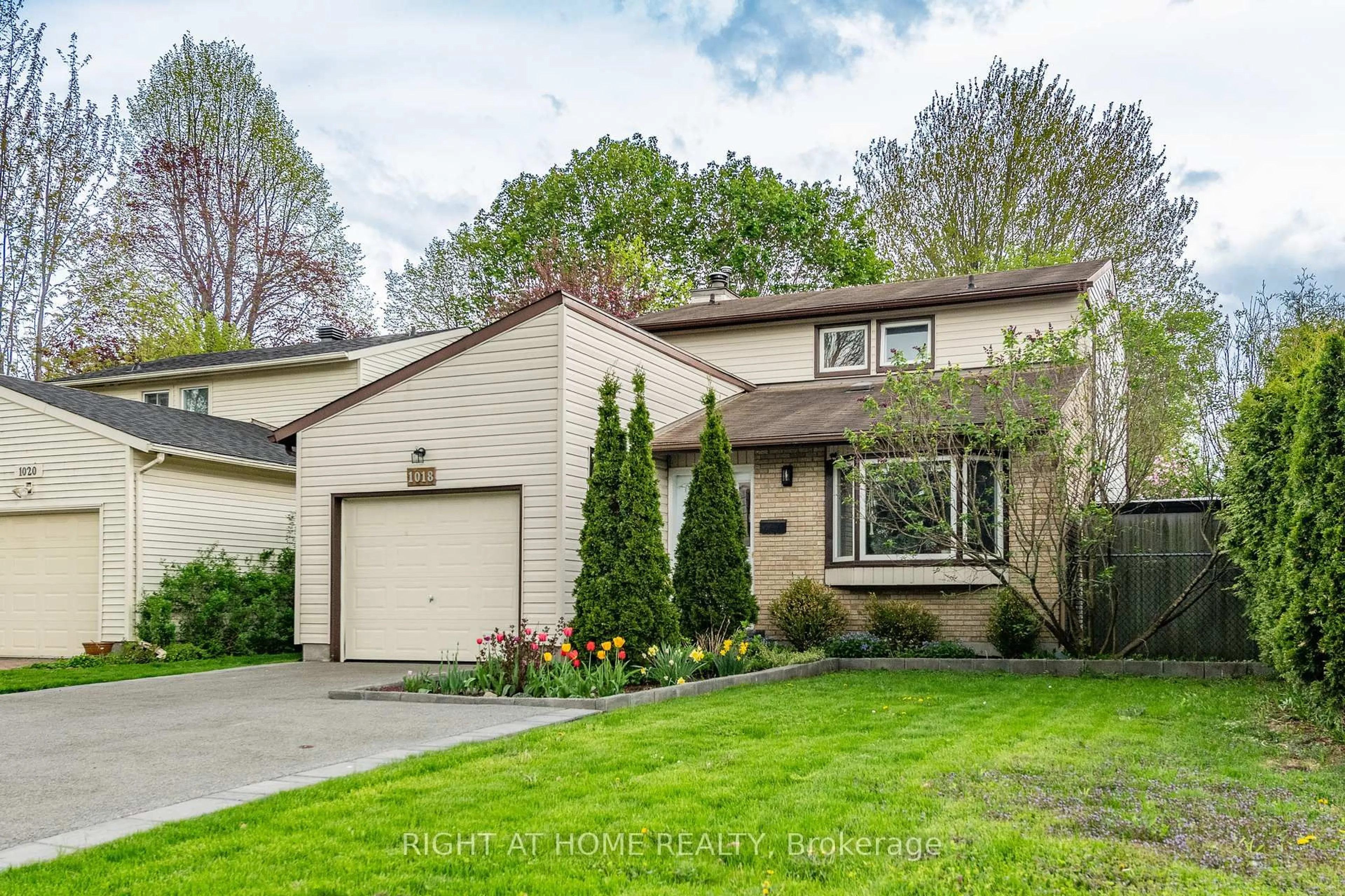 Home with vinyl exterior material, street for 1018 Chantenay Dr, Orleans Ontario K1C 2K9