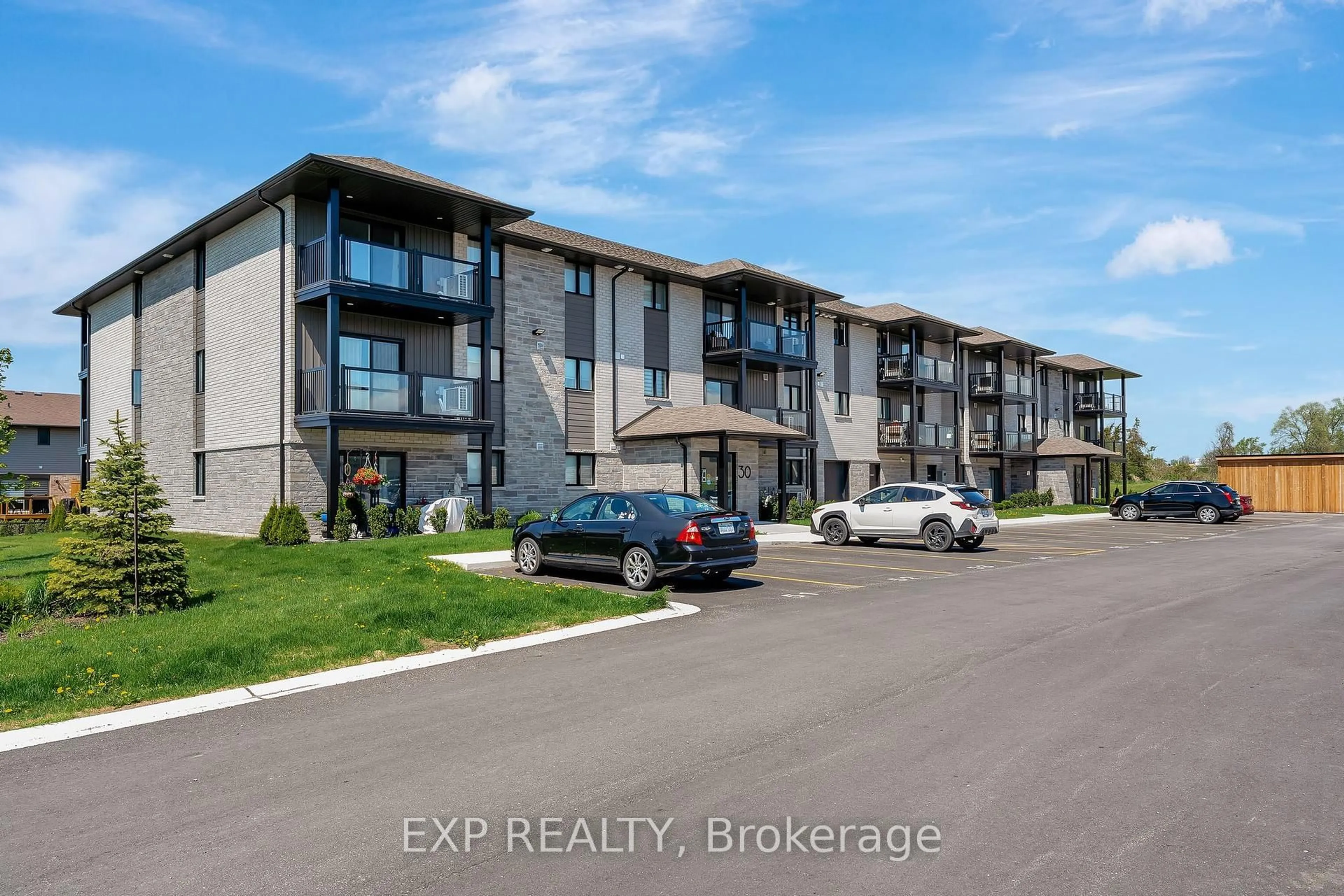 A pic from outside/outdoor area/front of a property/back of a property/a pic from drone, unknown for 30 Hillside Meadow Dr #303, Quinte West Ontario K8V 0J7