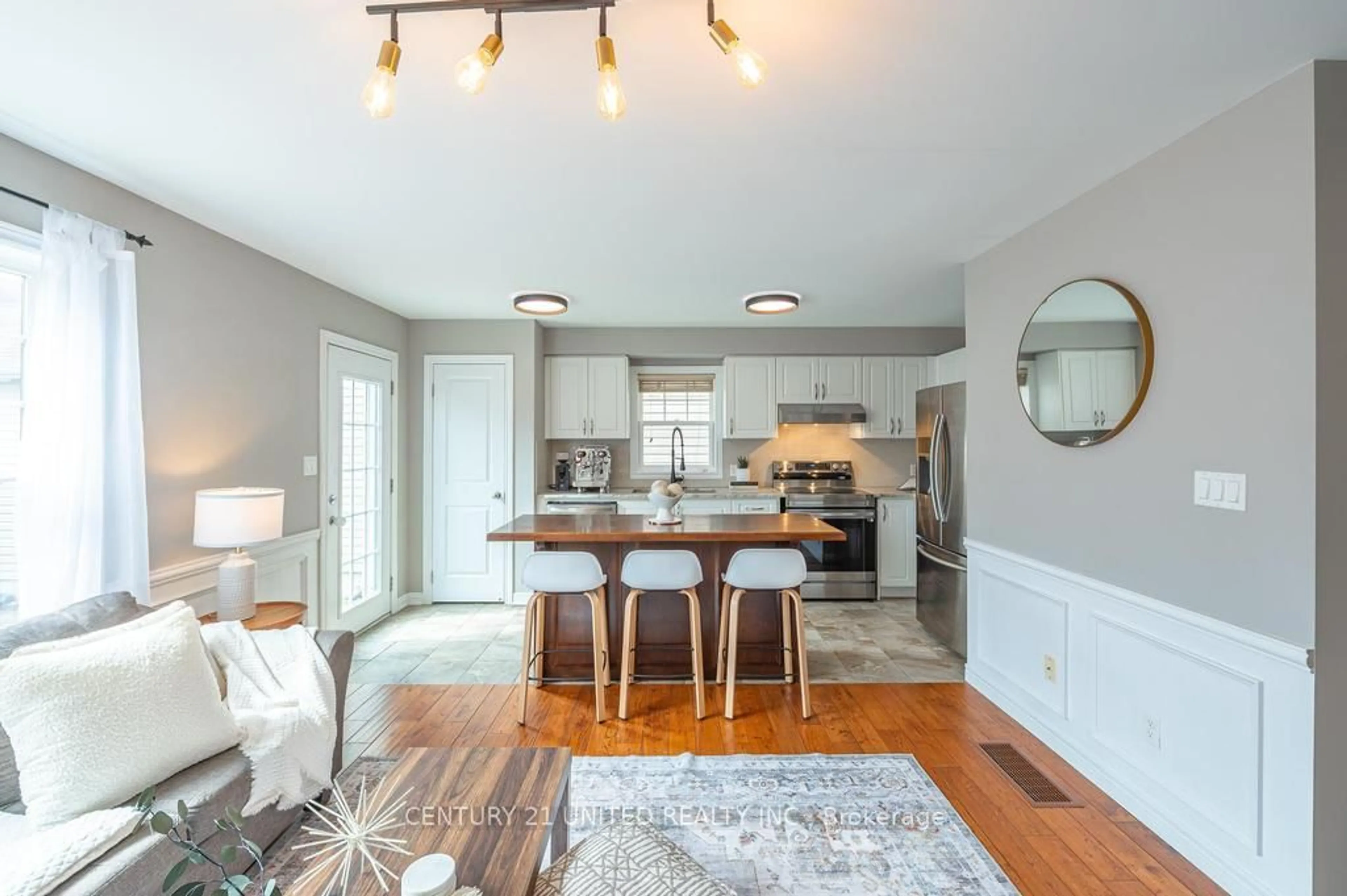 Open concept kitchen, wood/laminate floor for 912 Broadway Blvd, Peterborough North Ontario K9H 0G8