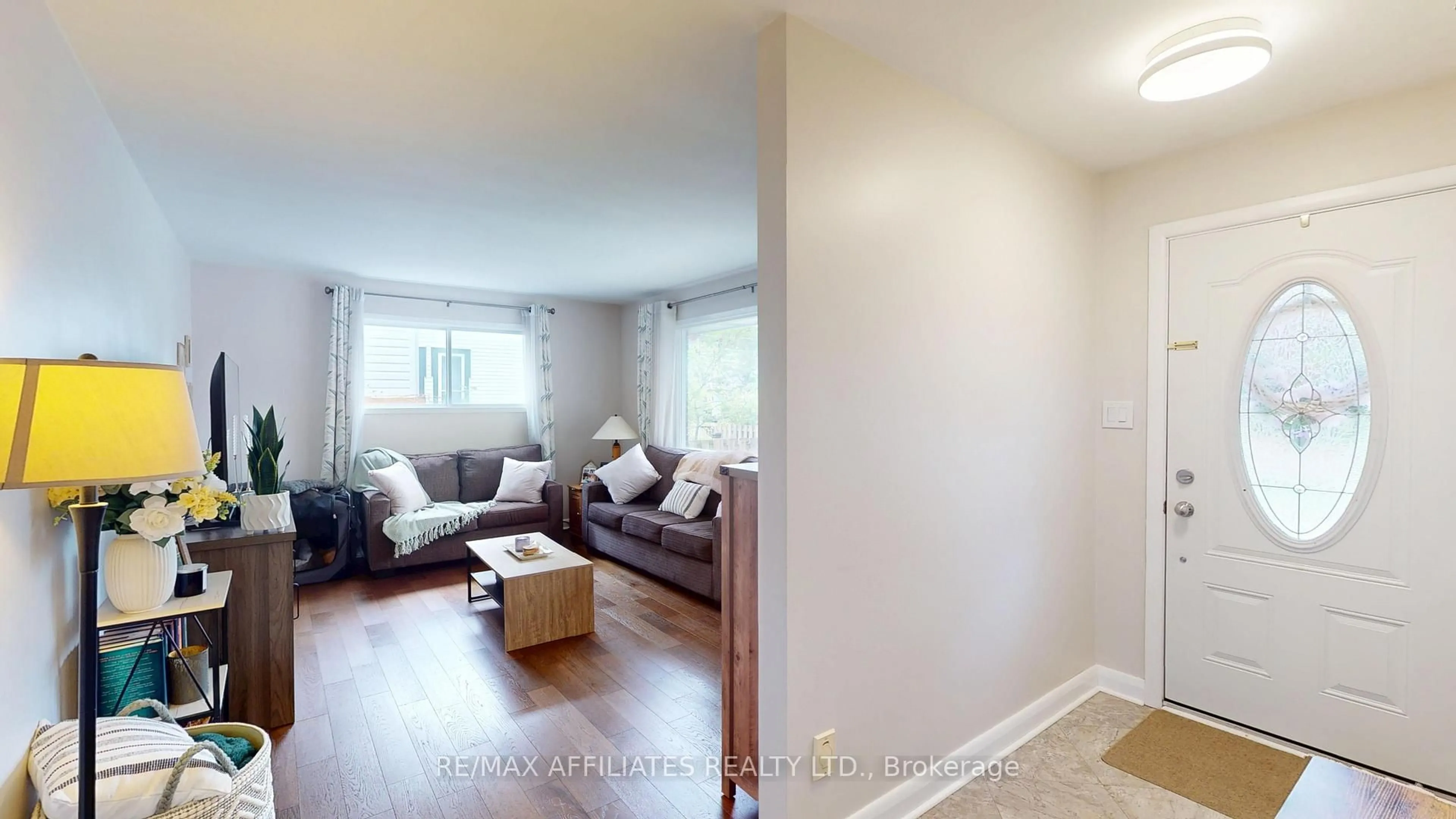 Living room with furniture, wood/laminate floor for 71 Ormond St, Brockville Ontario K6V 2K7