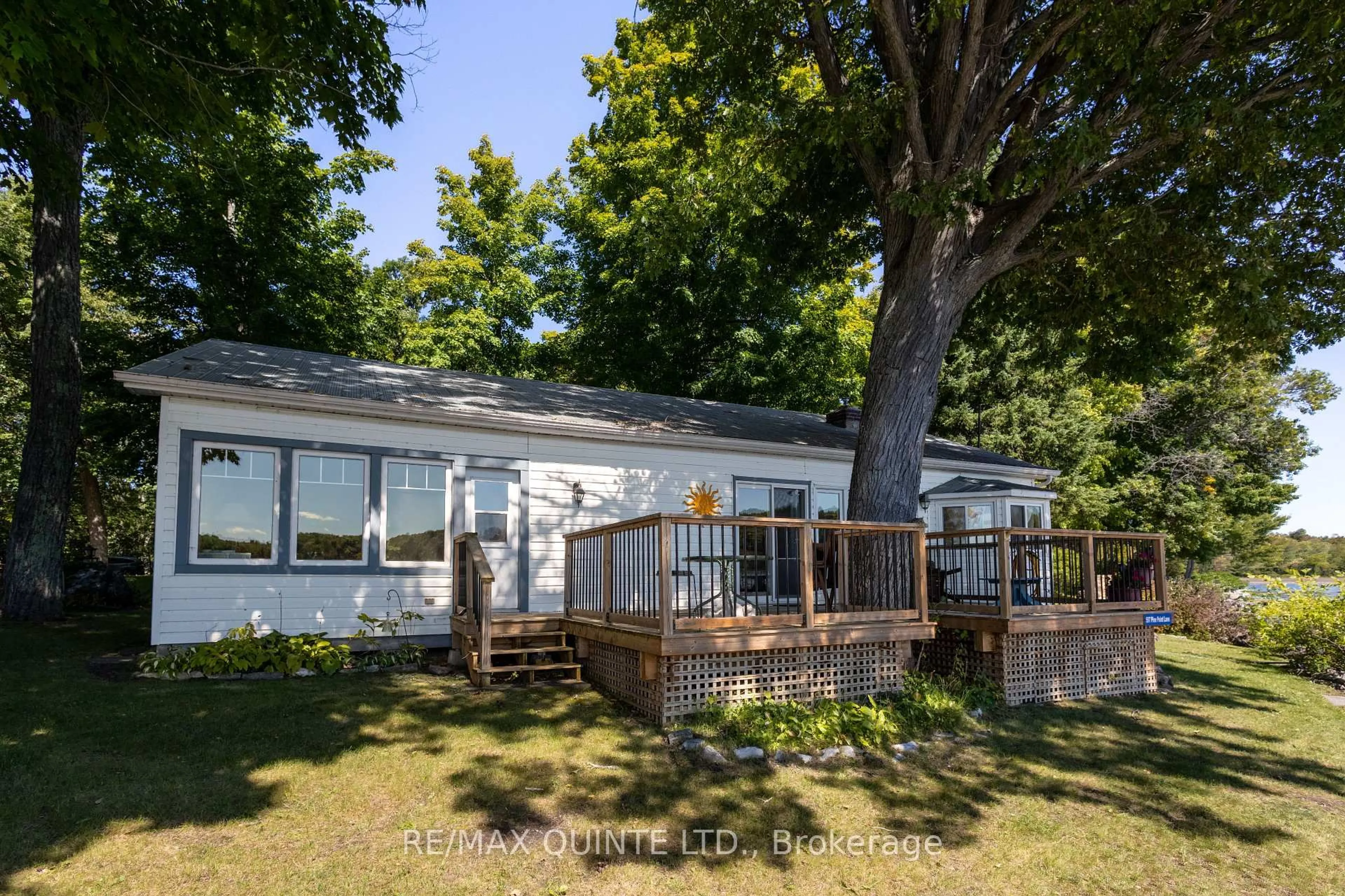 A pic from outside/outdoor area/front of a property/back of a property/a pic from drone, water/lake/river/ocean view for 597 Pine Point Lane, Madoc Ontario K0K 2K0
