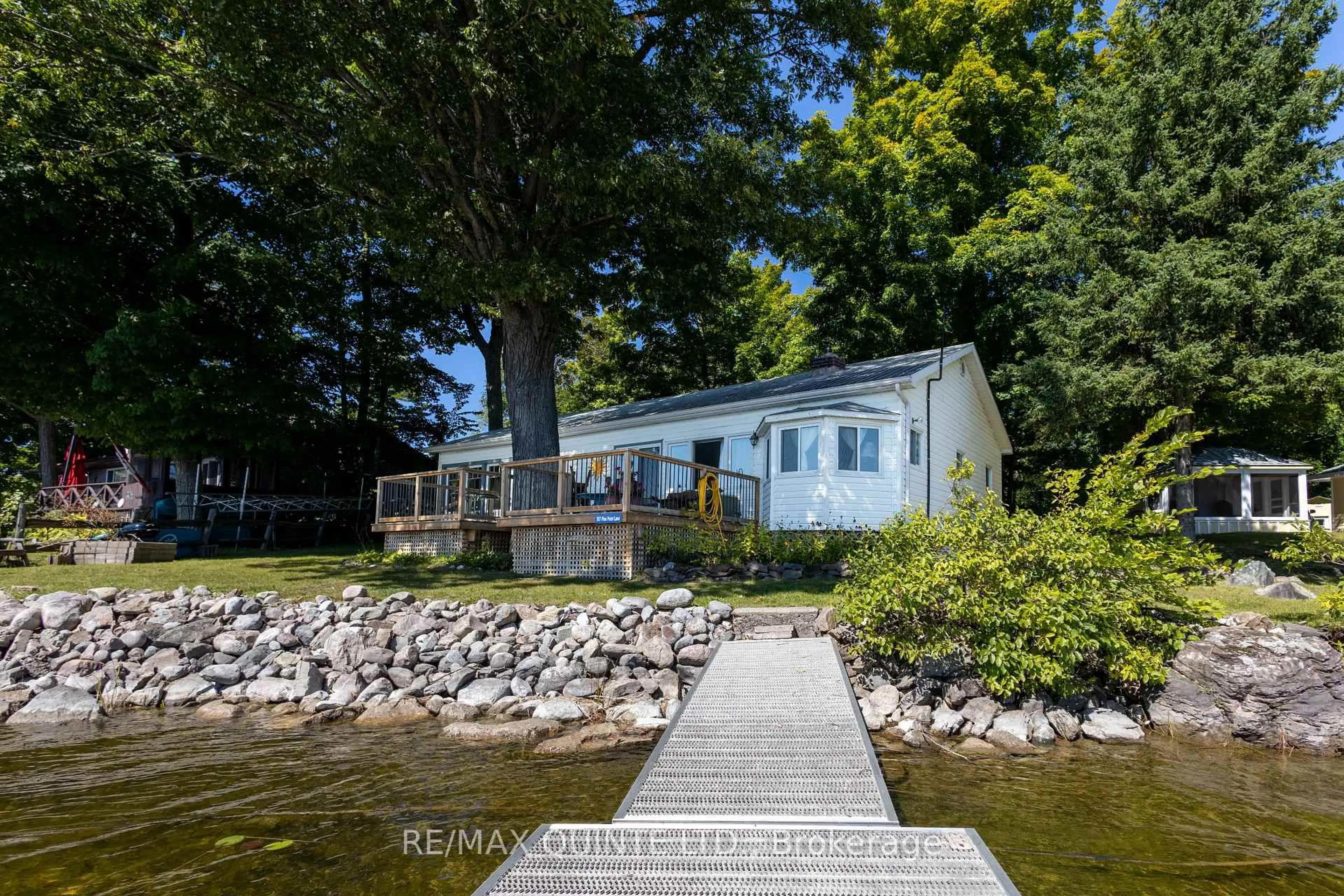 A pic from outside/outdoor area/front of a property/back of a property/a pic from drone, water/lake/river/ocean view for 597 Pine Point Lane, Madoc Ontario K0K 2K0