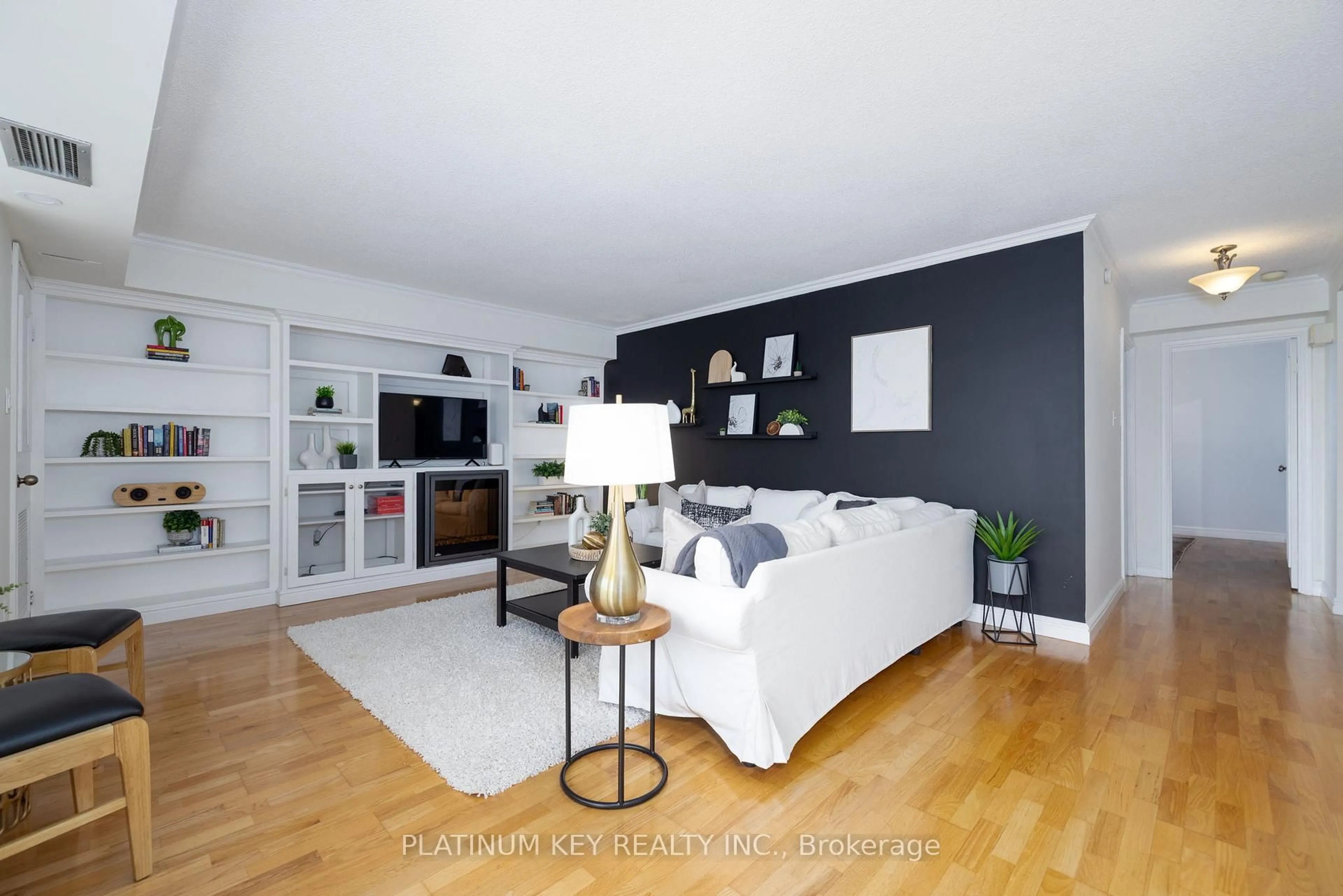 Living room with furniture, wood/laminate floor for 389 Dundas St #507, London East Ontario N6B 3L5