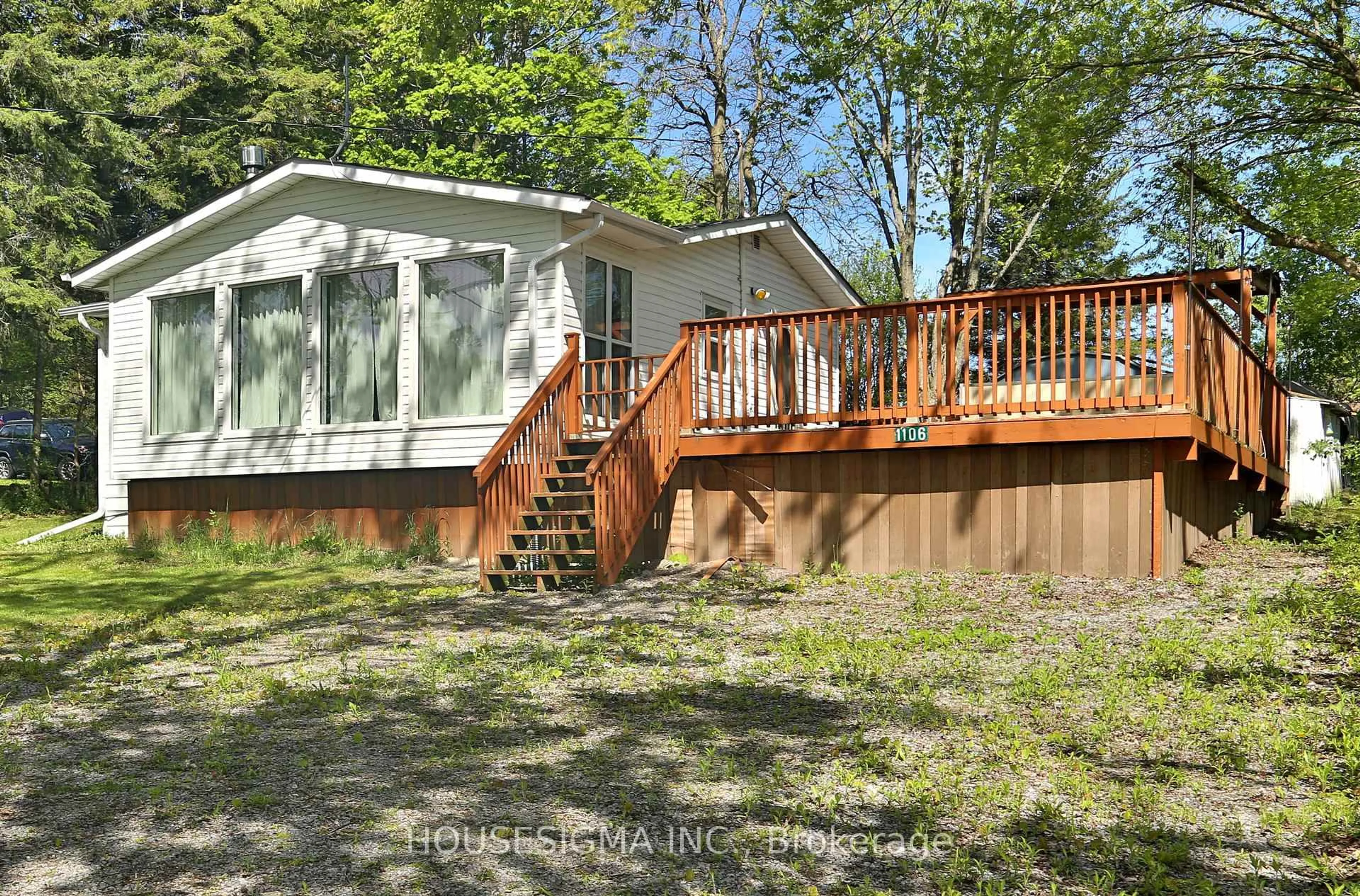 Home with vinyl exterior material, forest/trees view for 1106 Island View Dr, Otonabee-South Monaghan Ontario K0L 1B0
