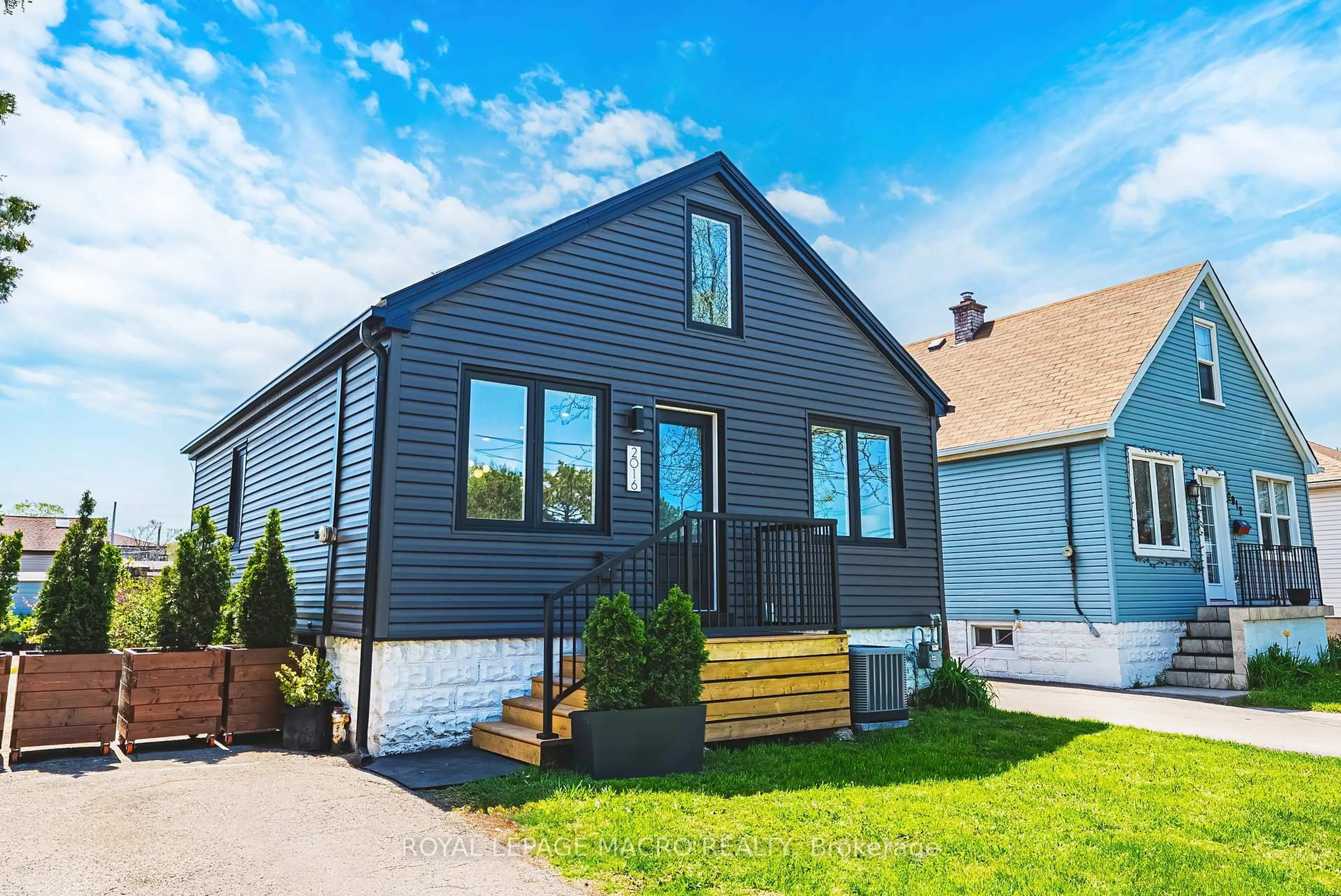 Home with vinyl exterior material, street for 2016 Barton St, Hamilton Ontario L8H 2Y8
