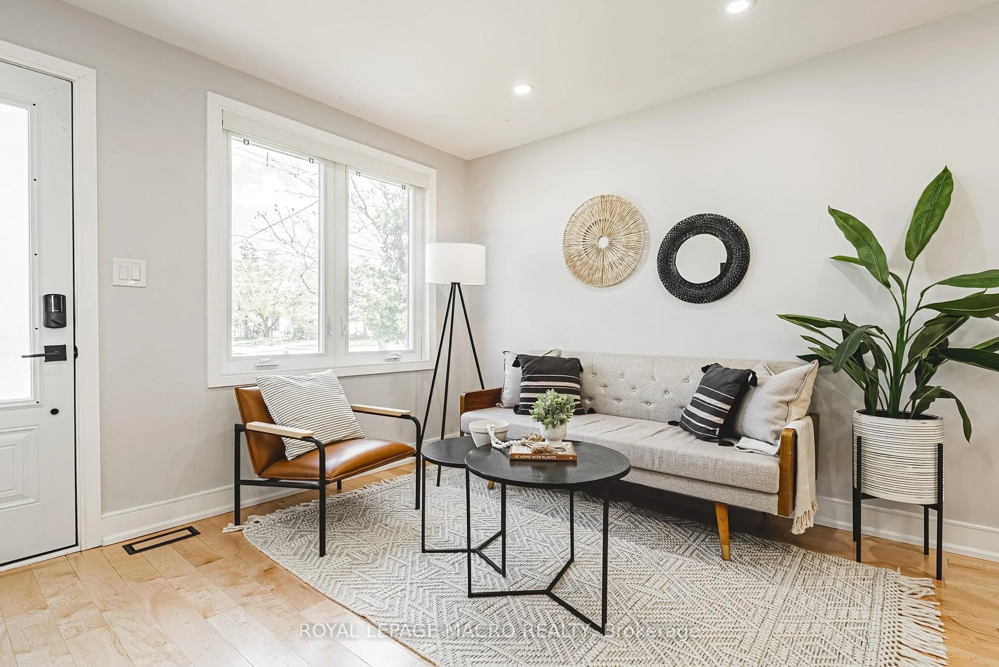 Living room with furniture, wood/laminate floor for 2016 Barton St, Hamilton Ontario L8H 2Y8