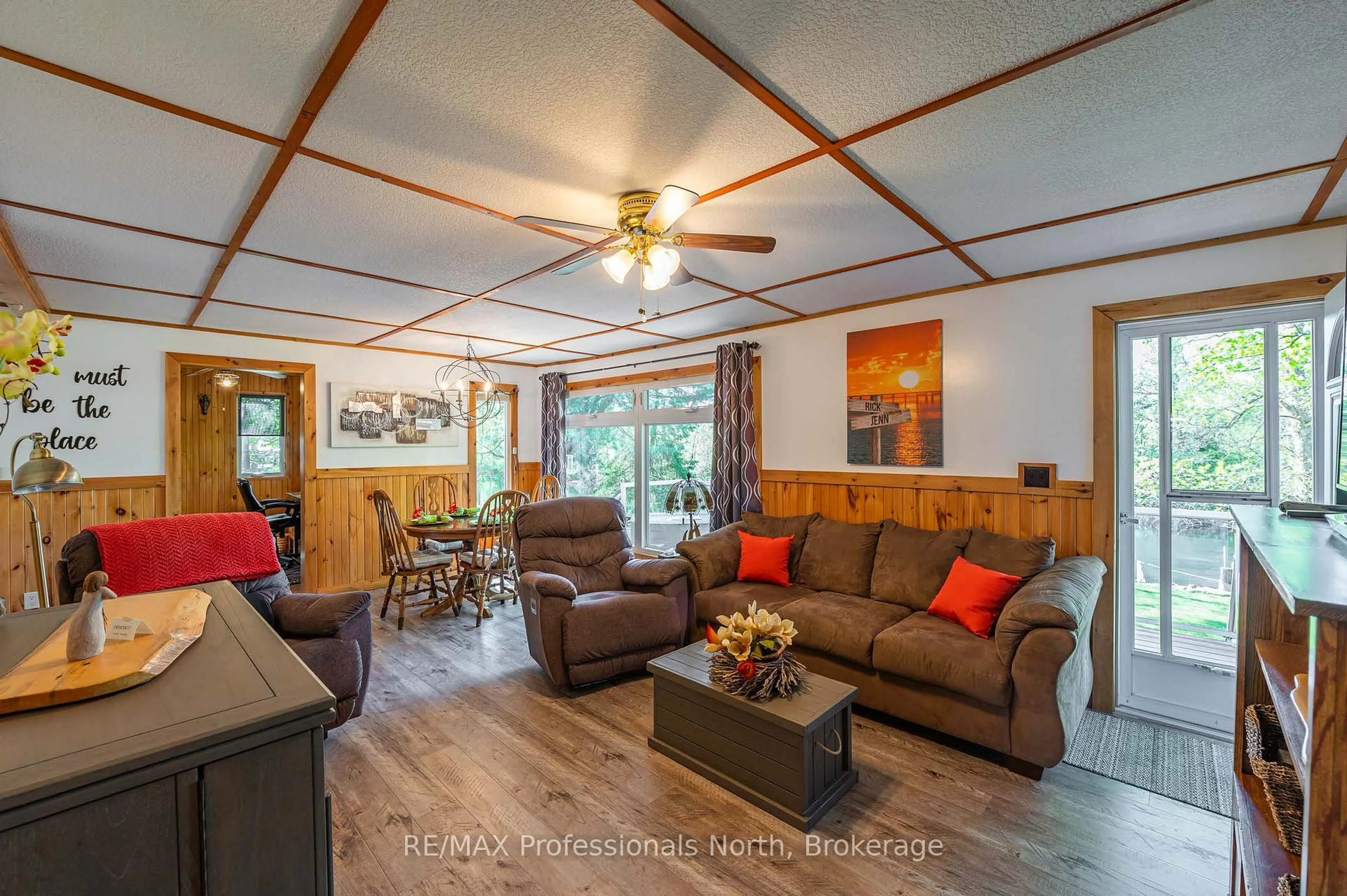 Living room with furniture, wood/laminate floor for 1027 Current Tr, Minden Hills Ontario K0M 2K0