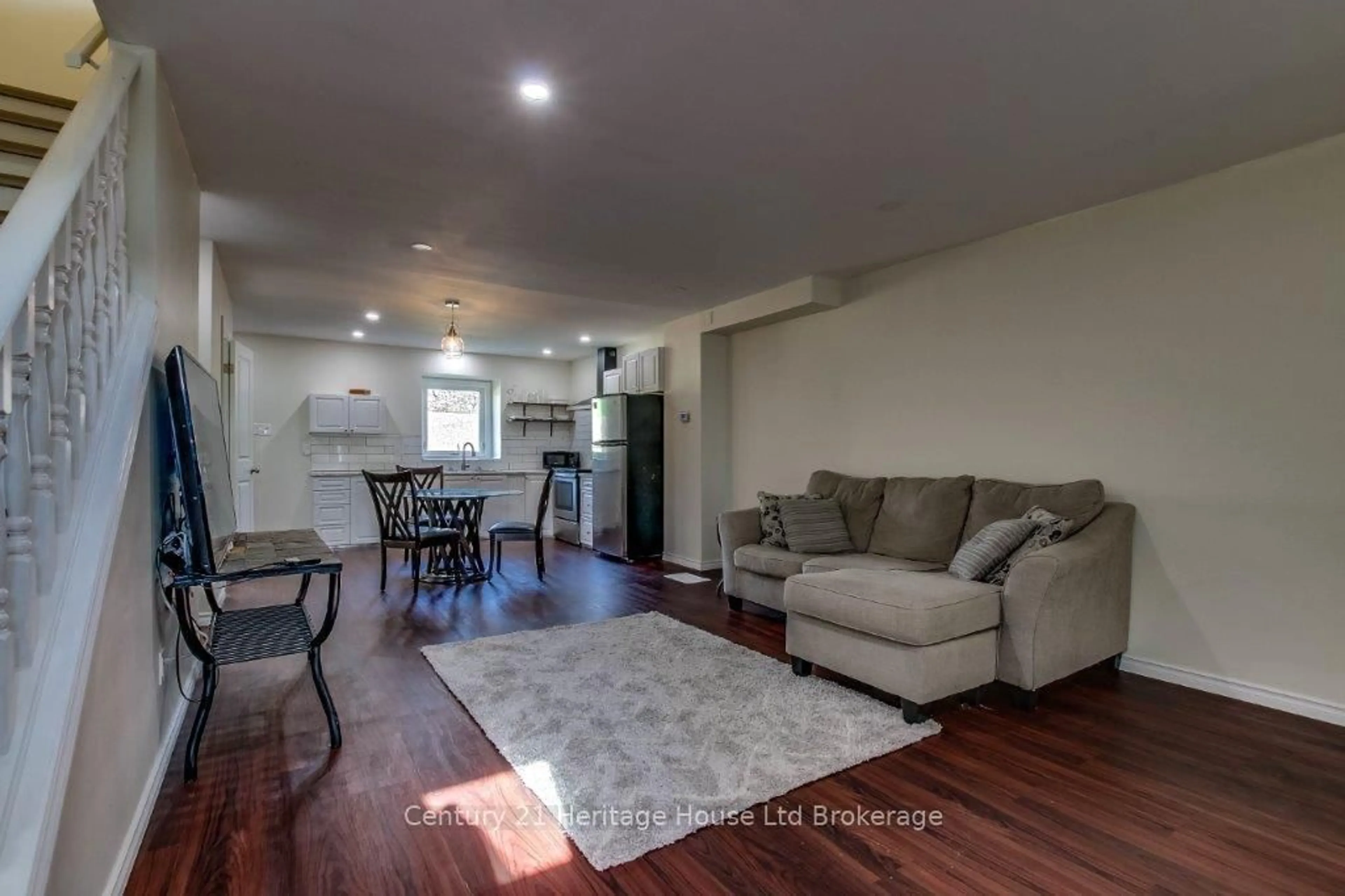 Living room with furniture, wood/laminate floor for 247 Lansdowne Ave #2, Woodstock Ontario N4T 1N6