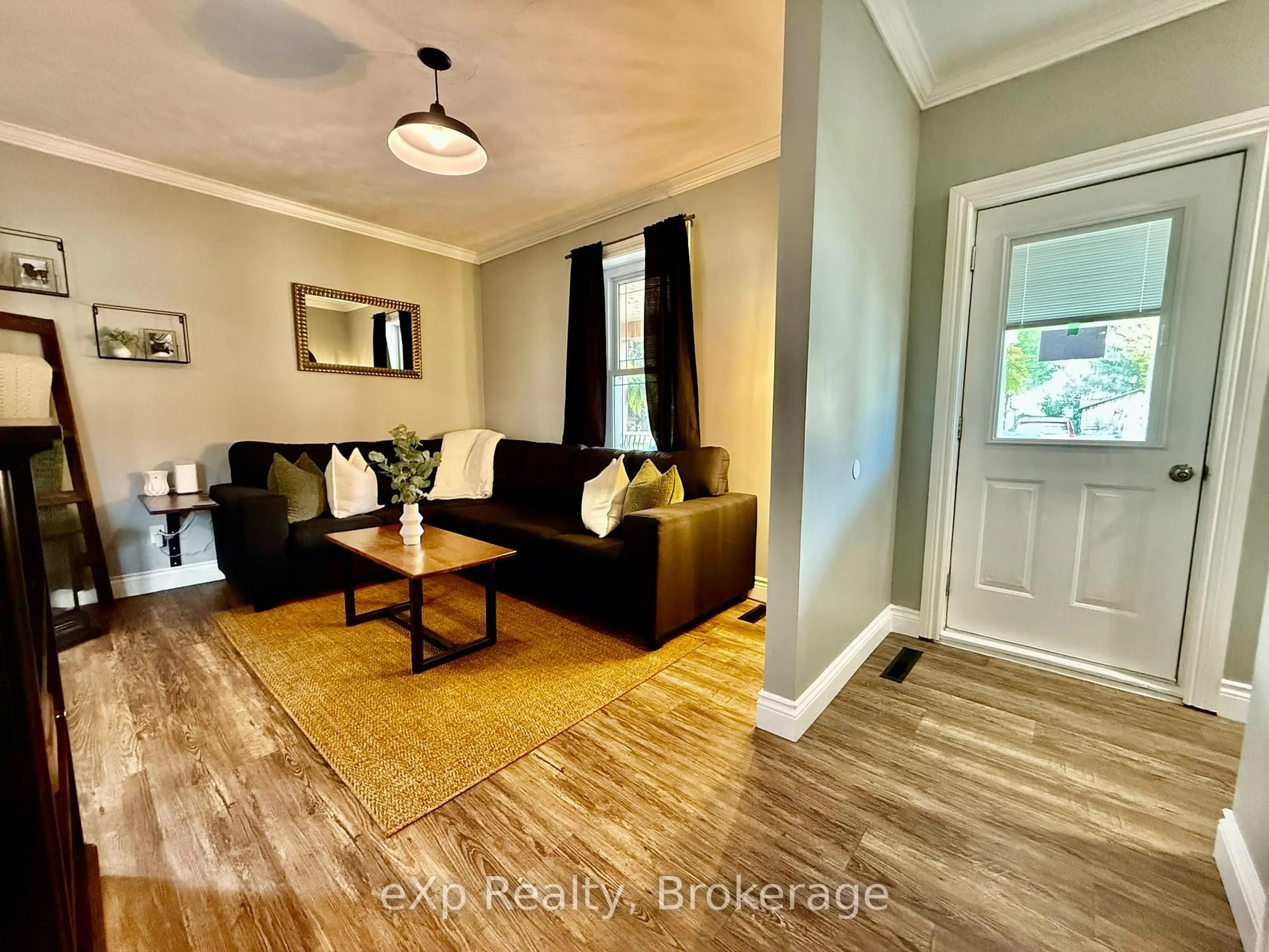Living room with furniture, wood/laminate floor for 28 King St, Brockton Ontario N0G 1J0