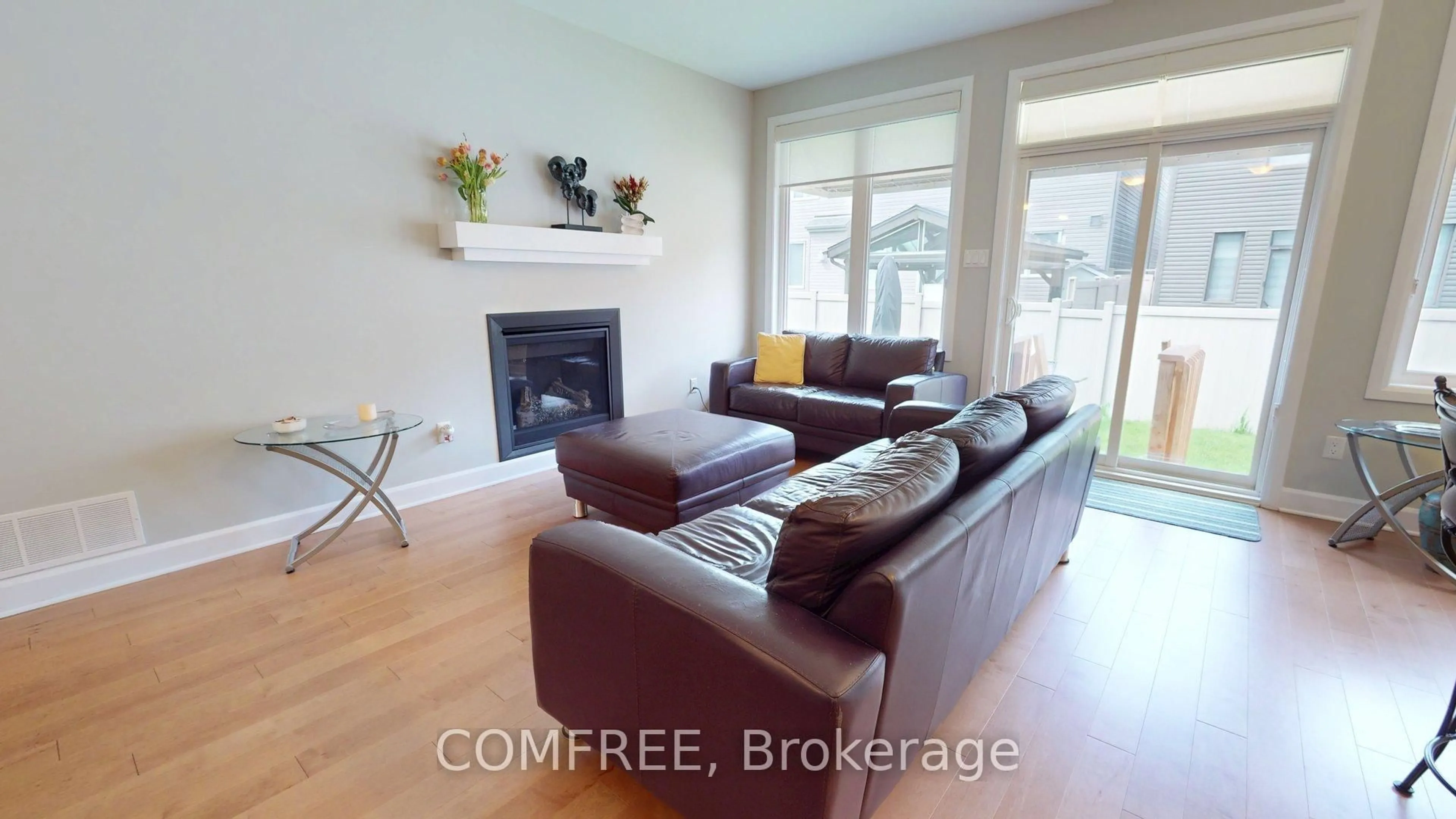 Living room with furniture, wood/laminate floor for 26 Stickleback Way, Ottawa Ontario K4A 1K9