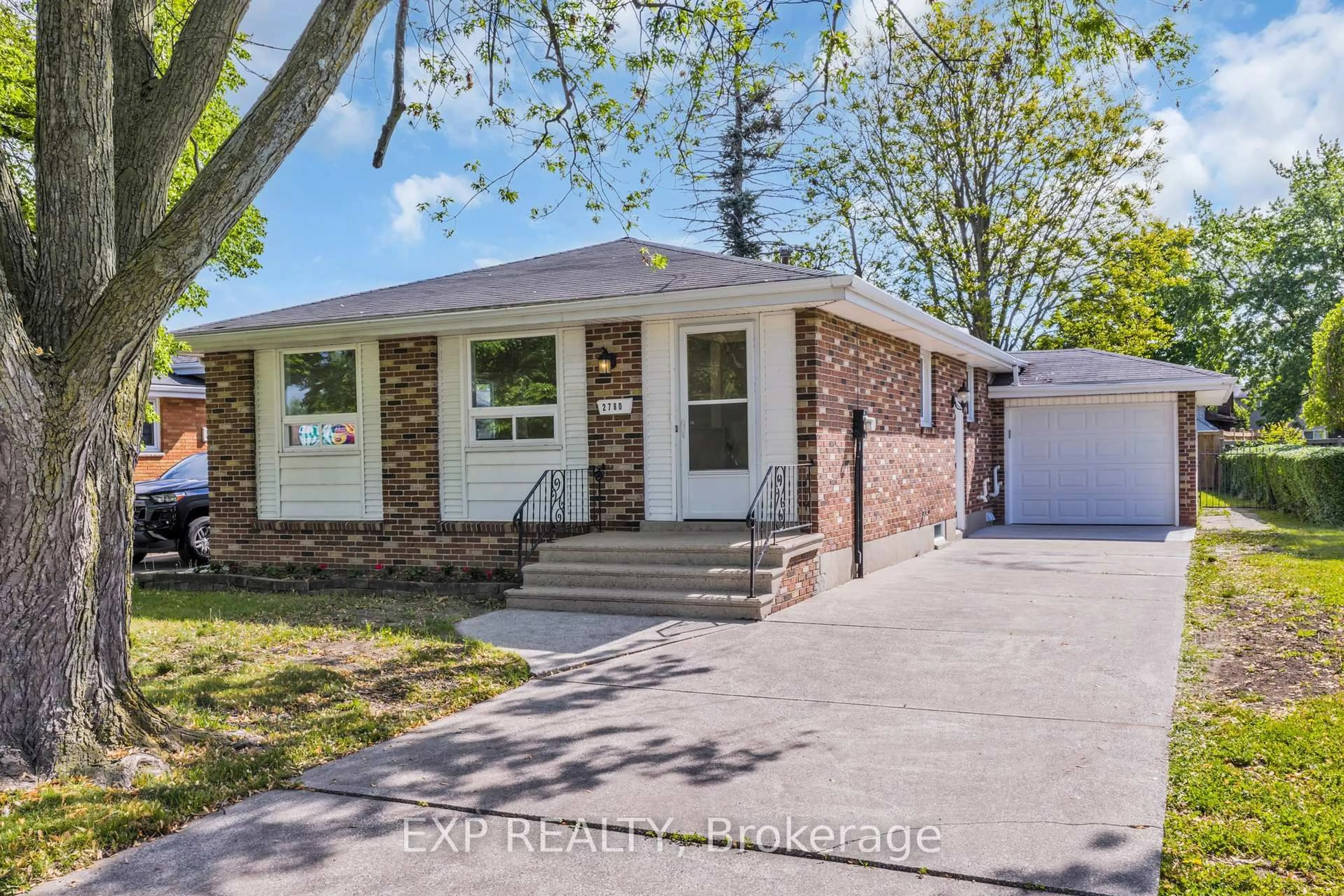 Home with brick exterior material, street for 2780 Forest Glade Dr, Windsor Ontario N8R 1L1