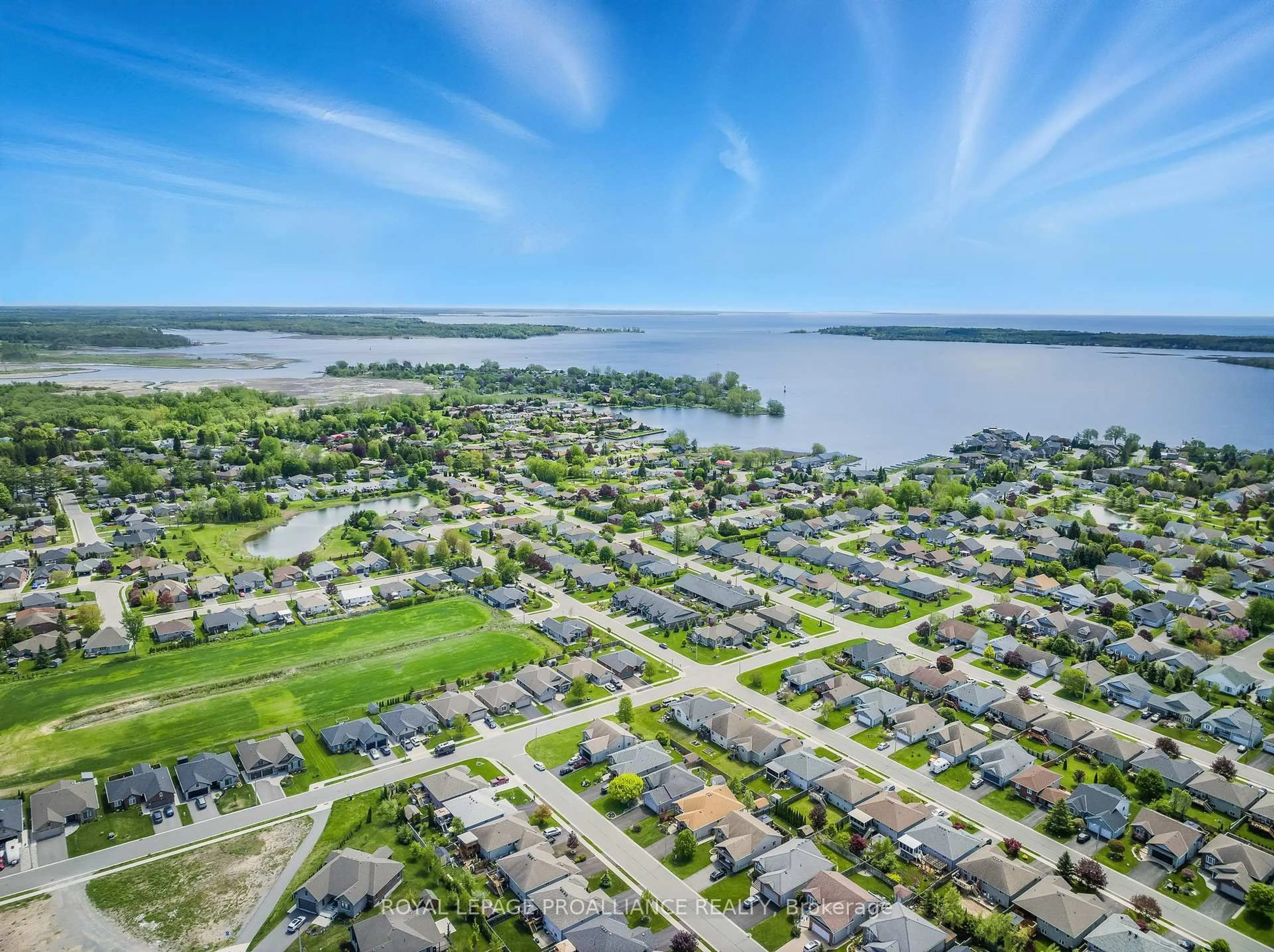 A pic from outside/outdoor area/front of a property/back of a property/a pic from drone, water/lake/river/ocean view for 27 Cove Cres, Brighton Ontario K0K 1H0