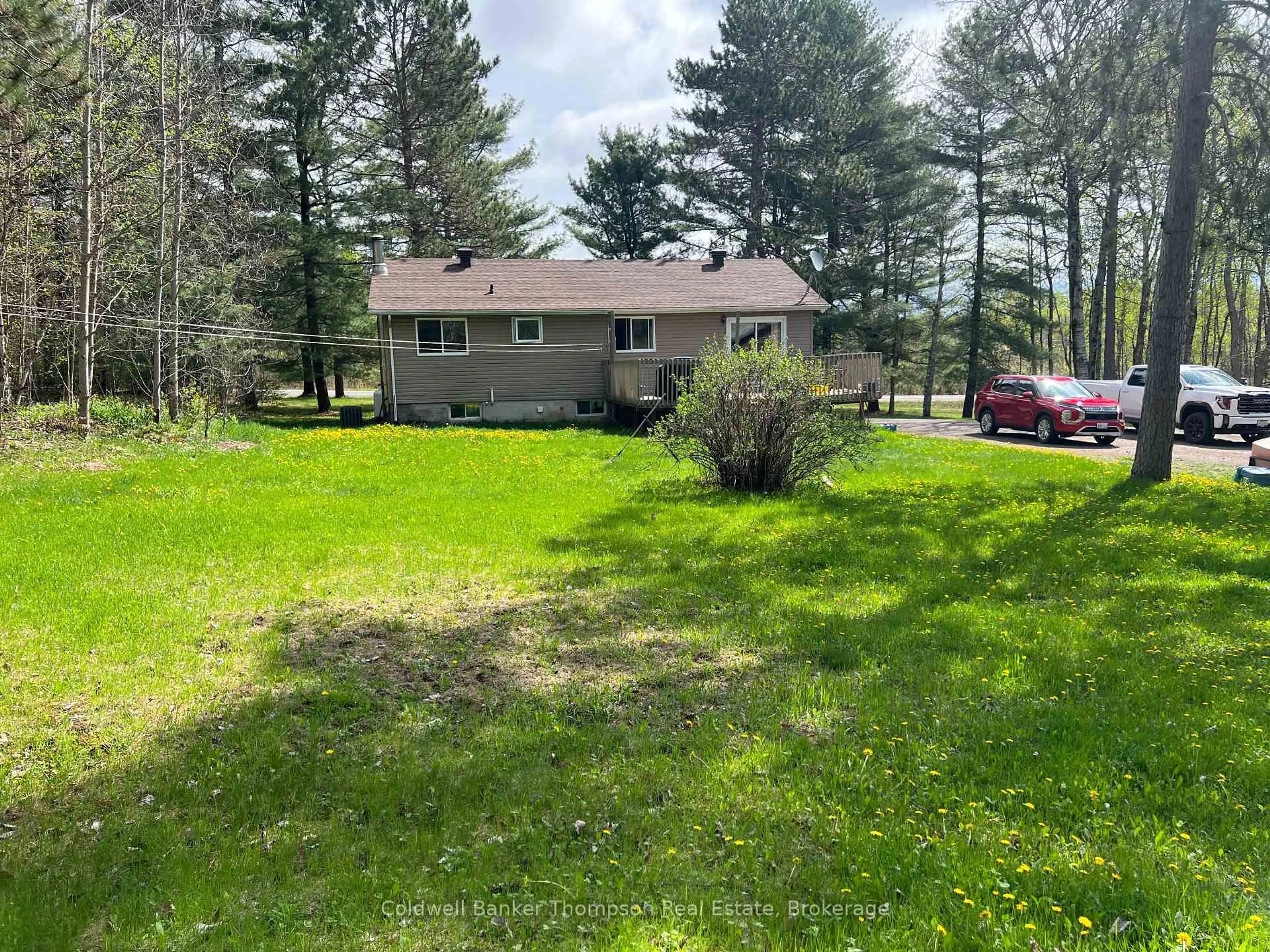 A pic from outside/outdoor area/front of a property/back of a property/a pic from drone, forest/trees view for 3106 Hwy 654 Highway, Nipissing Ontario P0H 1H0