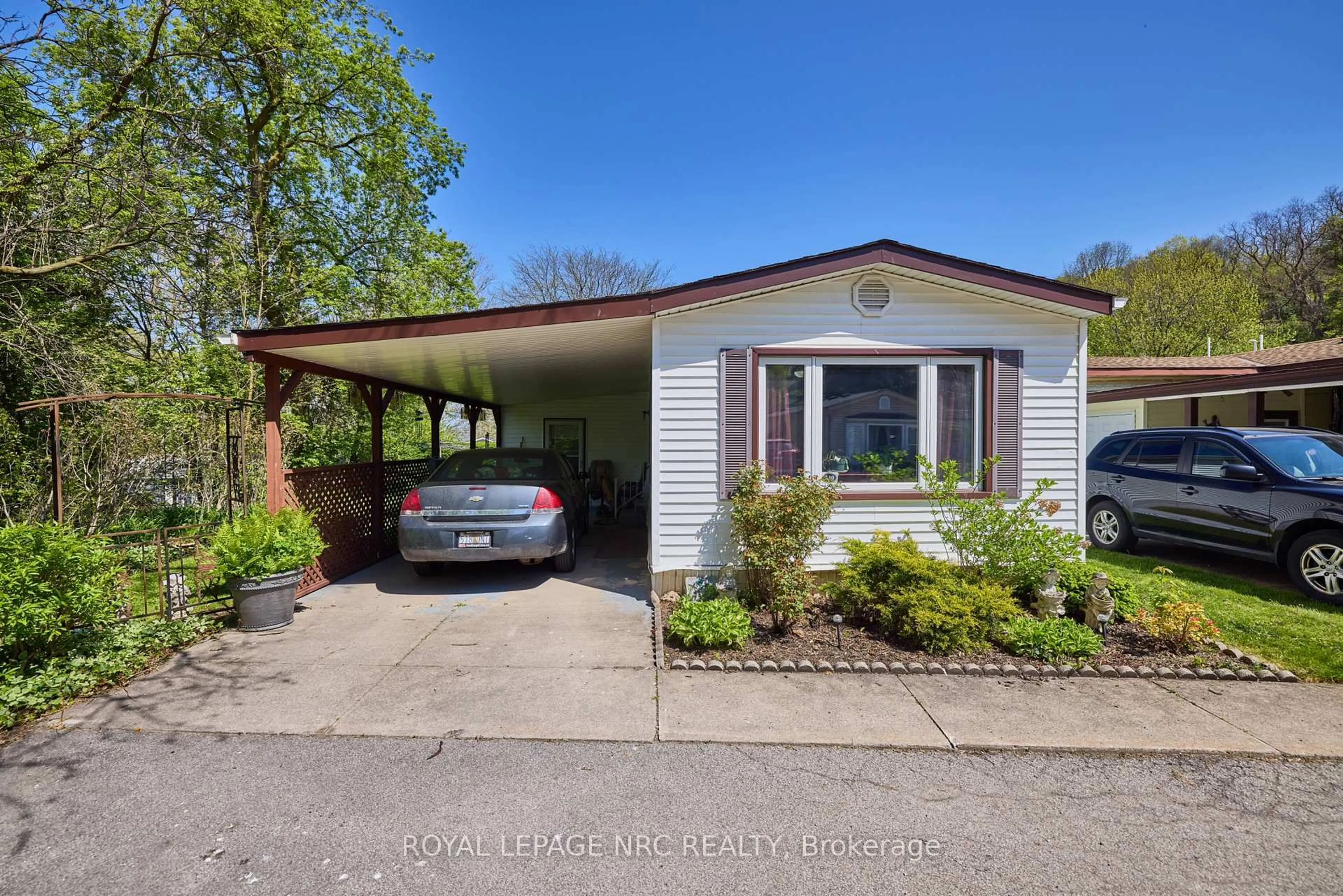 Home with vinyl exterior material, street for 23 Four Mile Creek Rd #240, Niagara-on-the-Lake Ontario L0S 1J1