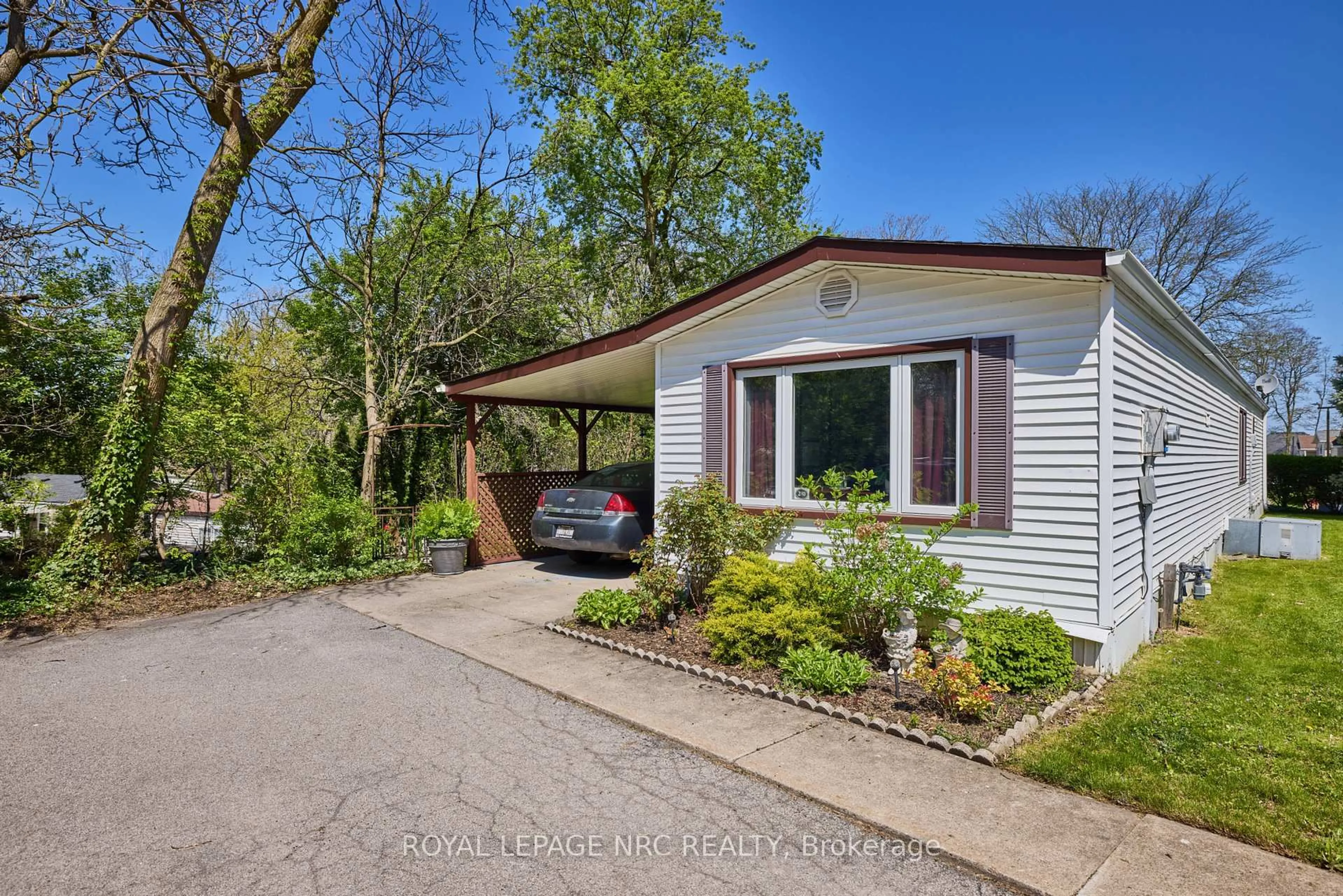 Home with vinyl exterior material, street for 23 Four Mile Creek Rd #240, Niagara-on-the-Lake Ontario L0S 1J1