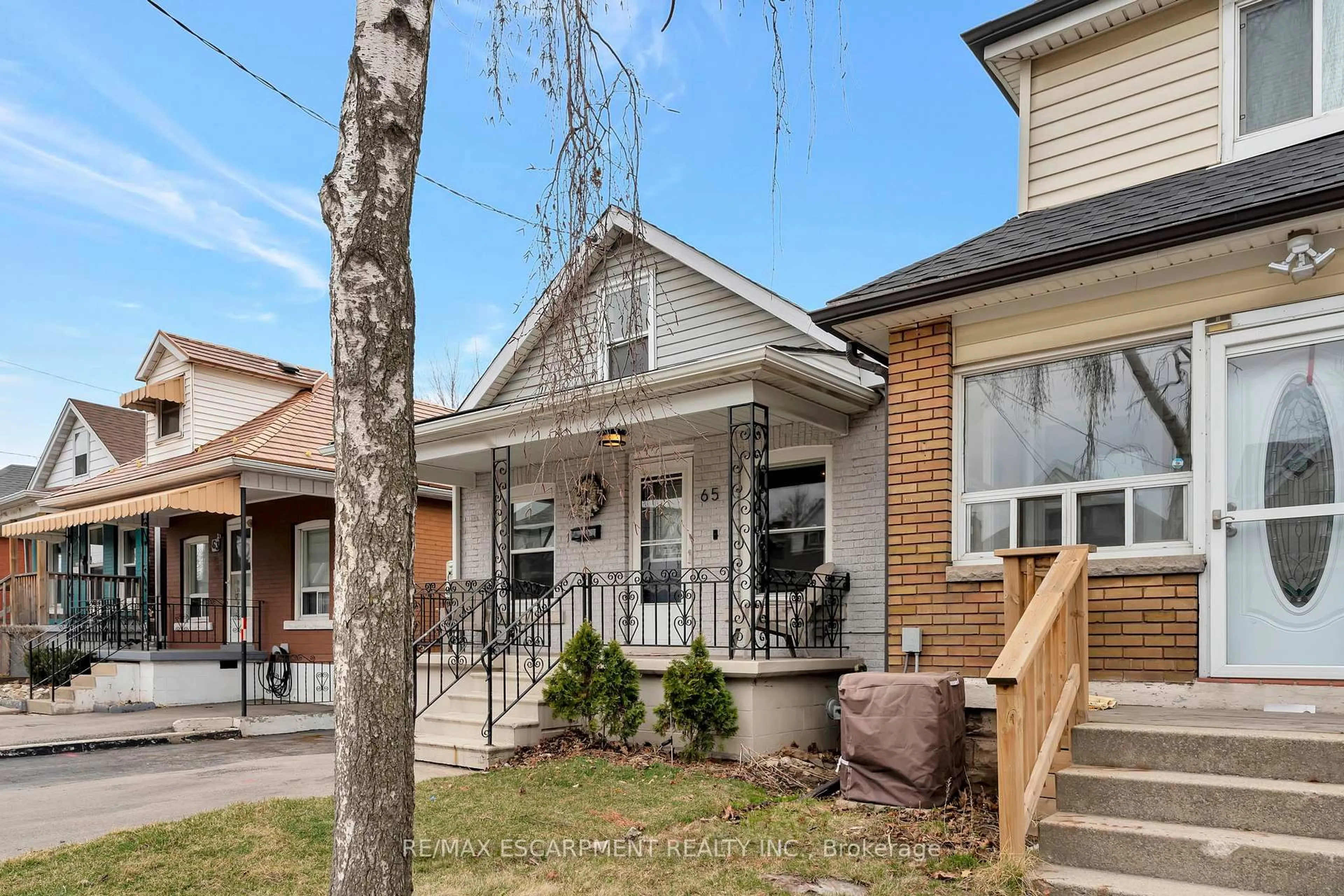 Home with brick exterior material, street for 65 Connaught Ave, Hamilton Ontario L8L 6Y9