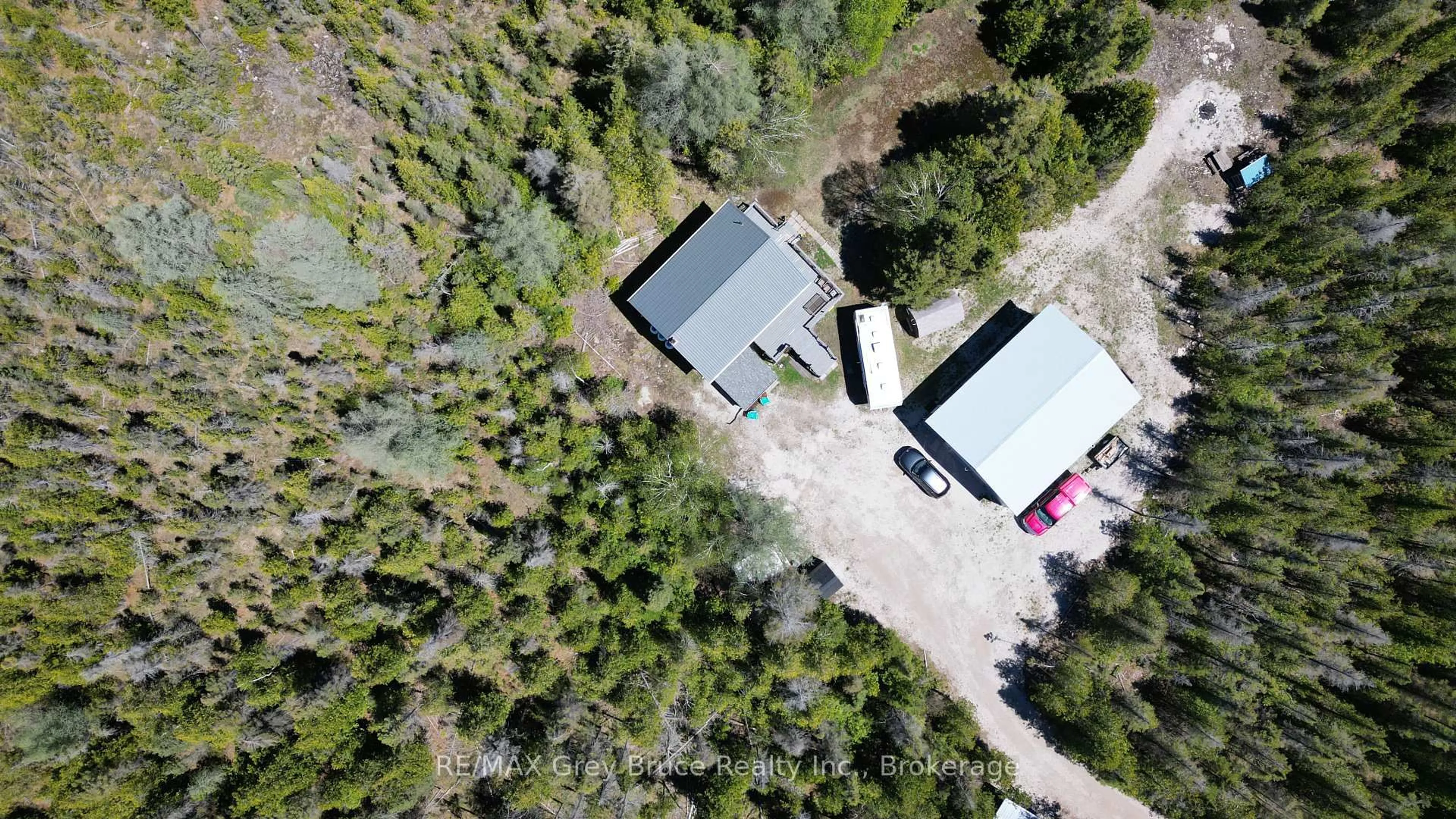 A pic from outside/outdoor area/front of a property/back of a property/a pic from drone, forest/trees view for 46 Youngblood Rd, Northern Bruce Peninsula Ontario N0H 1Z0