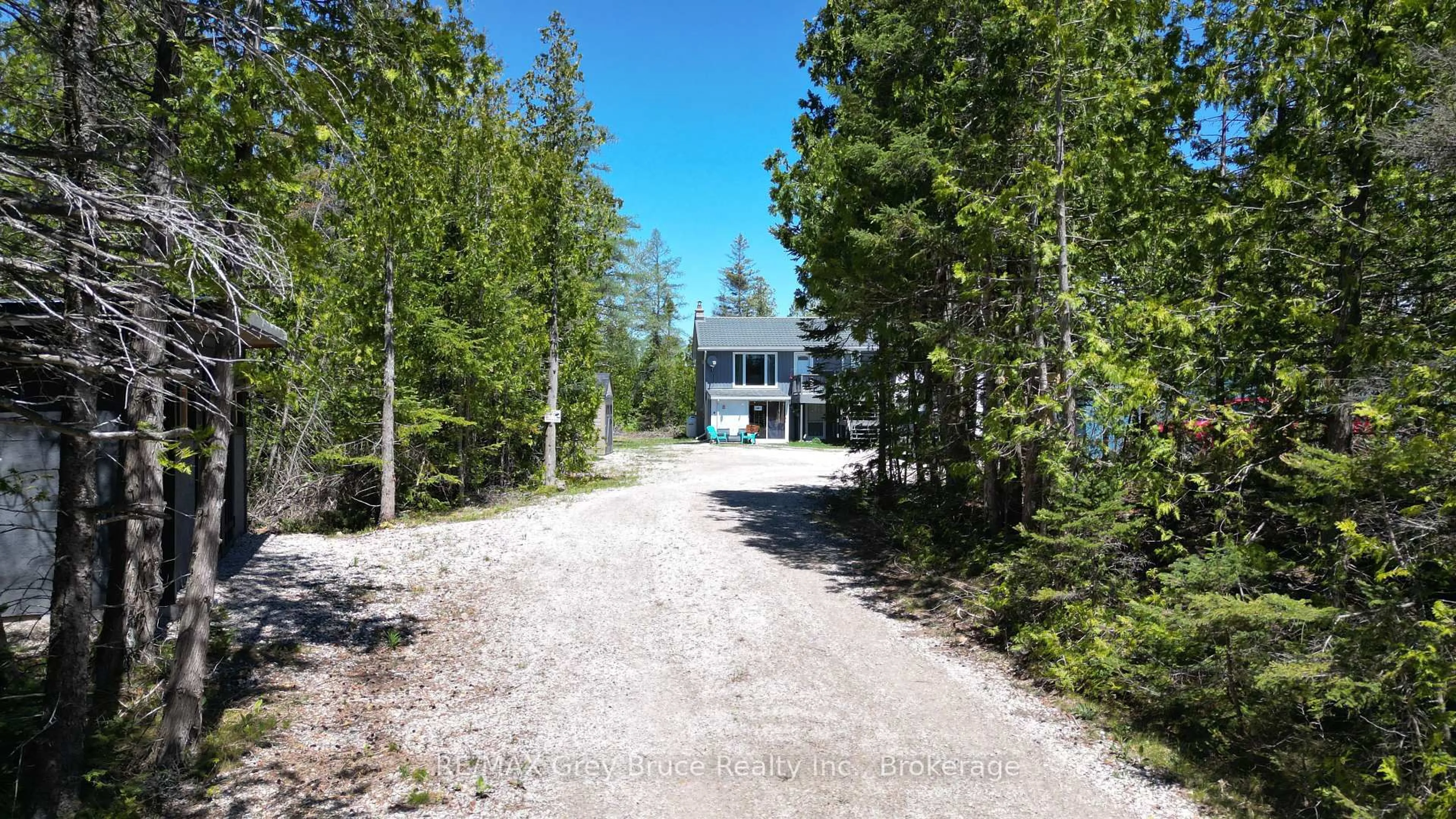 A pic from outside/outdoor area/front of a property/back of a property/a pic from drone, forest/trees view for 46 Youngblood Rd, Northern Bruce Peninsula Ontario N0H 1Z0