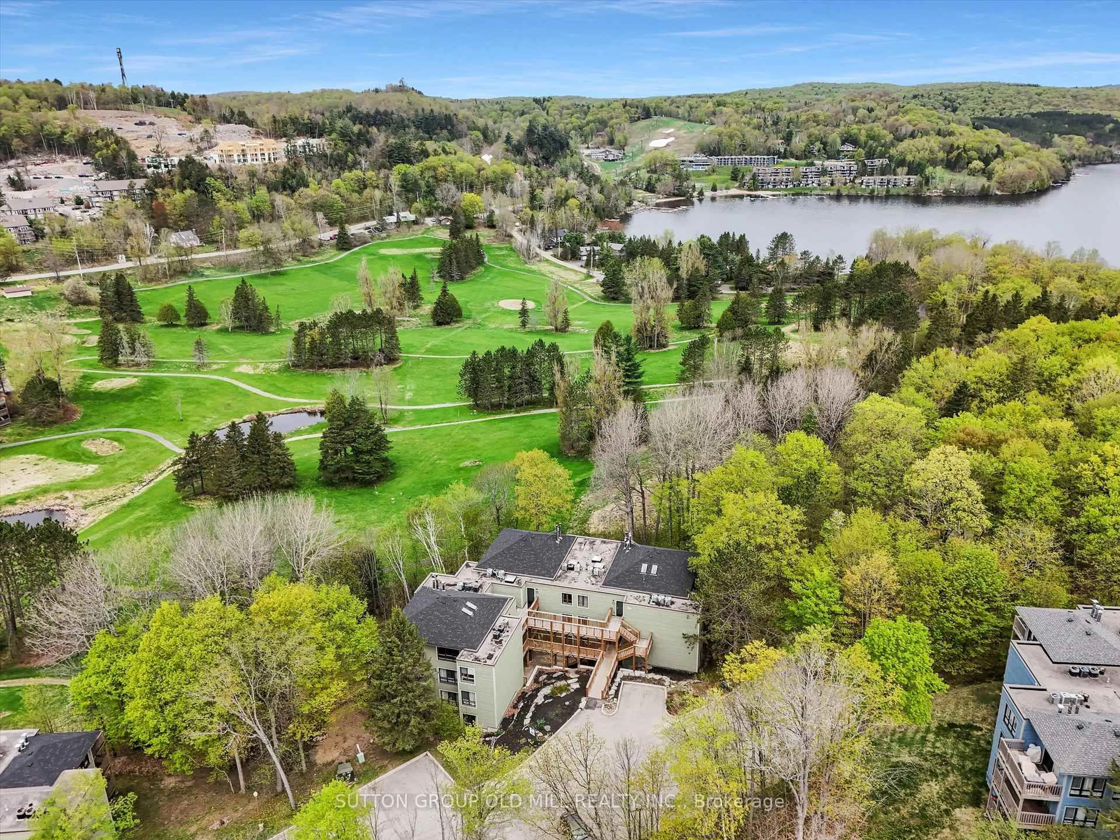 A pic from outside/outdoor area/front of a property/back of a property/a pic from drone, water/lake/river/ocean view for 26 Deerhurst Dr #203, Huntsville Ontario P1H 1A9