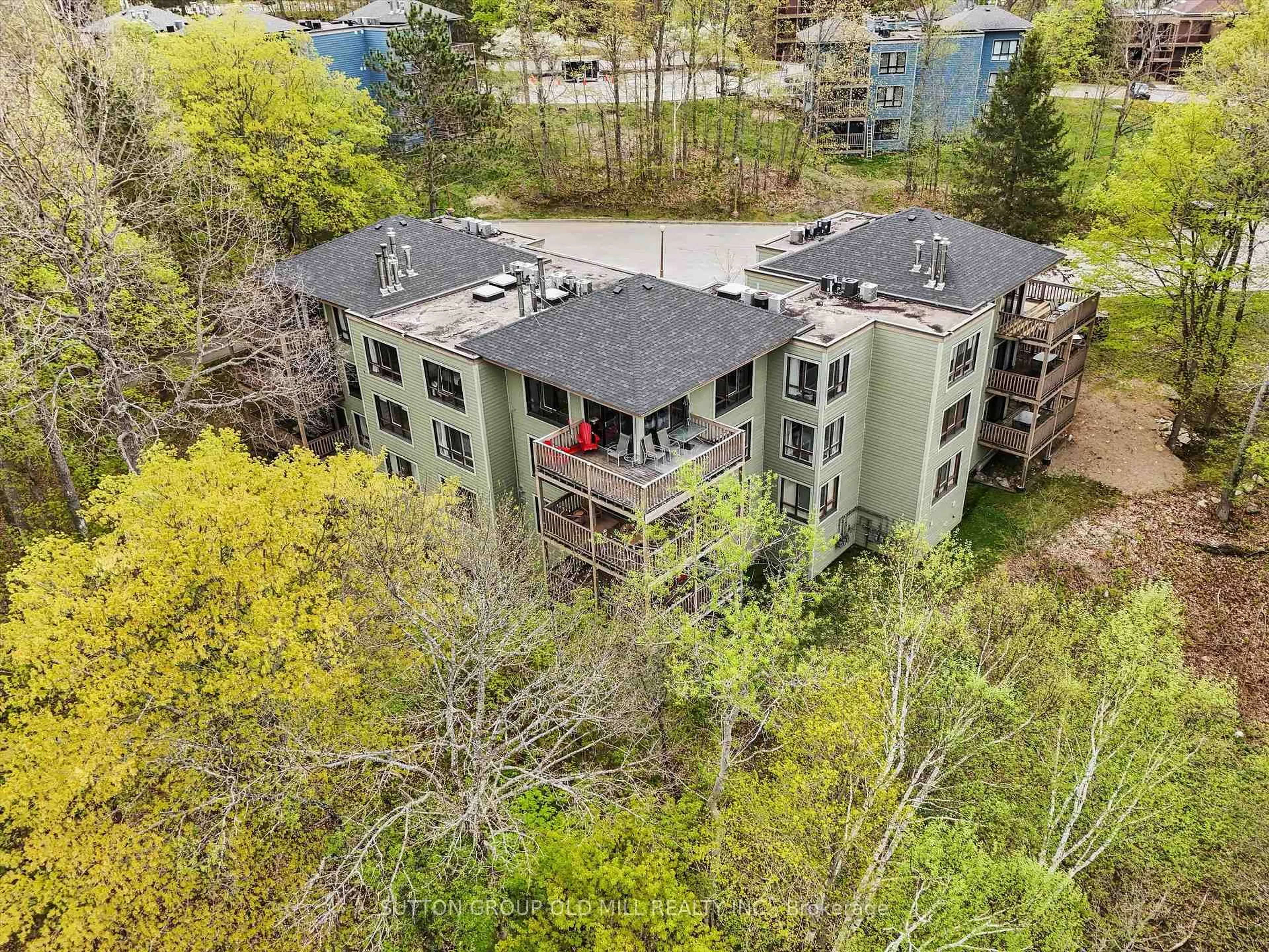 A pic from outside/outdoor area/front of a property/back of a property/a pic from drone, water/lake/river/ocean view for 26 Deerhurst Dr #203, Huntsville Ontario P1H 1A9