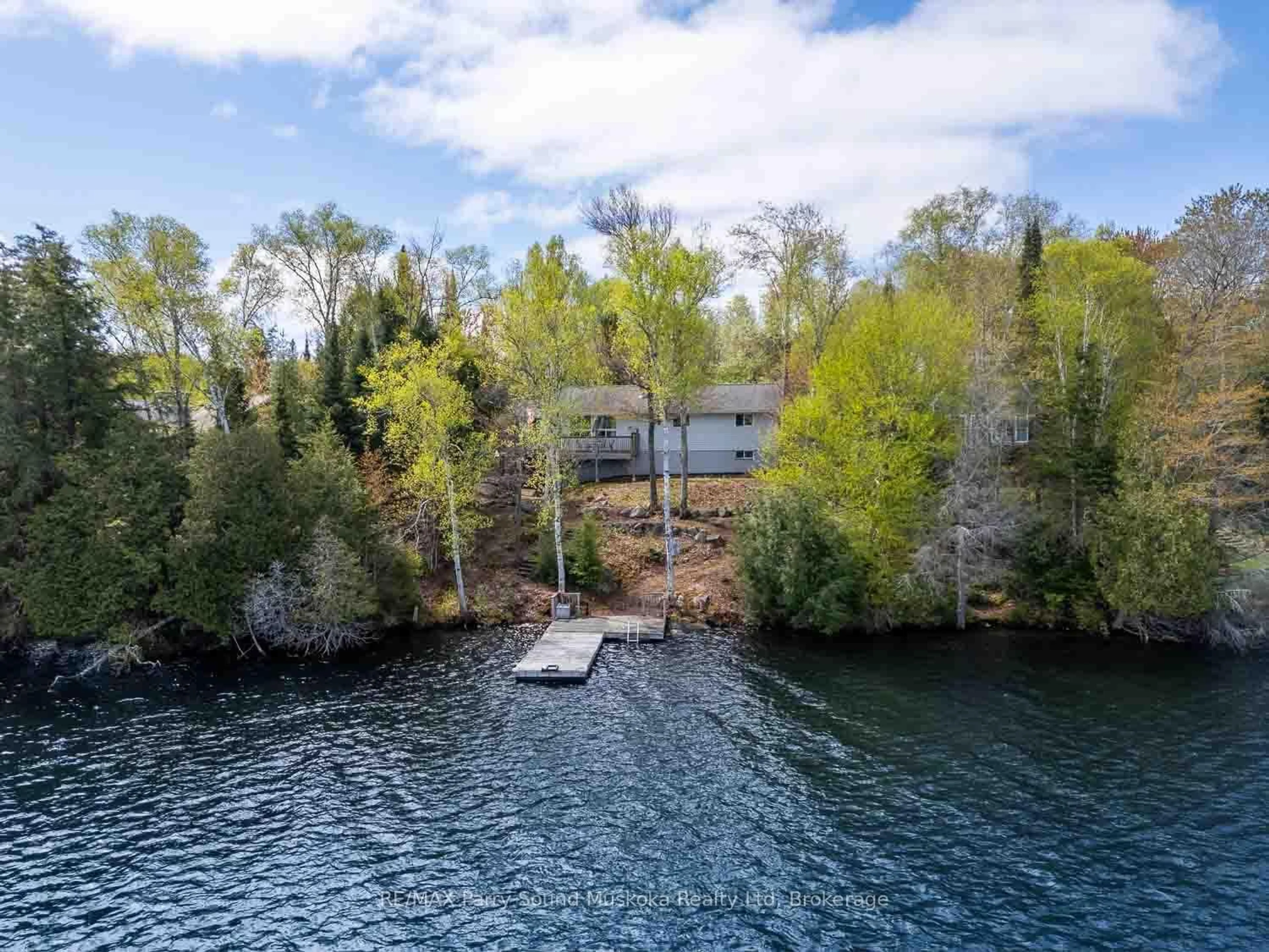 A pic from outside/outdoor area/front of a property/back of a property/a pic from drone, water/lake/river/ocean view for 1931 B South Horn Lake Rd, Magnetawan Ontario P0A 1C0
