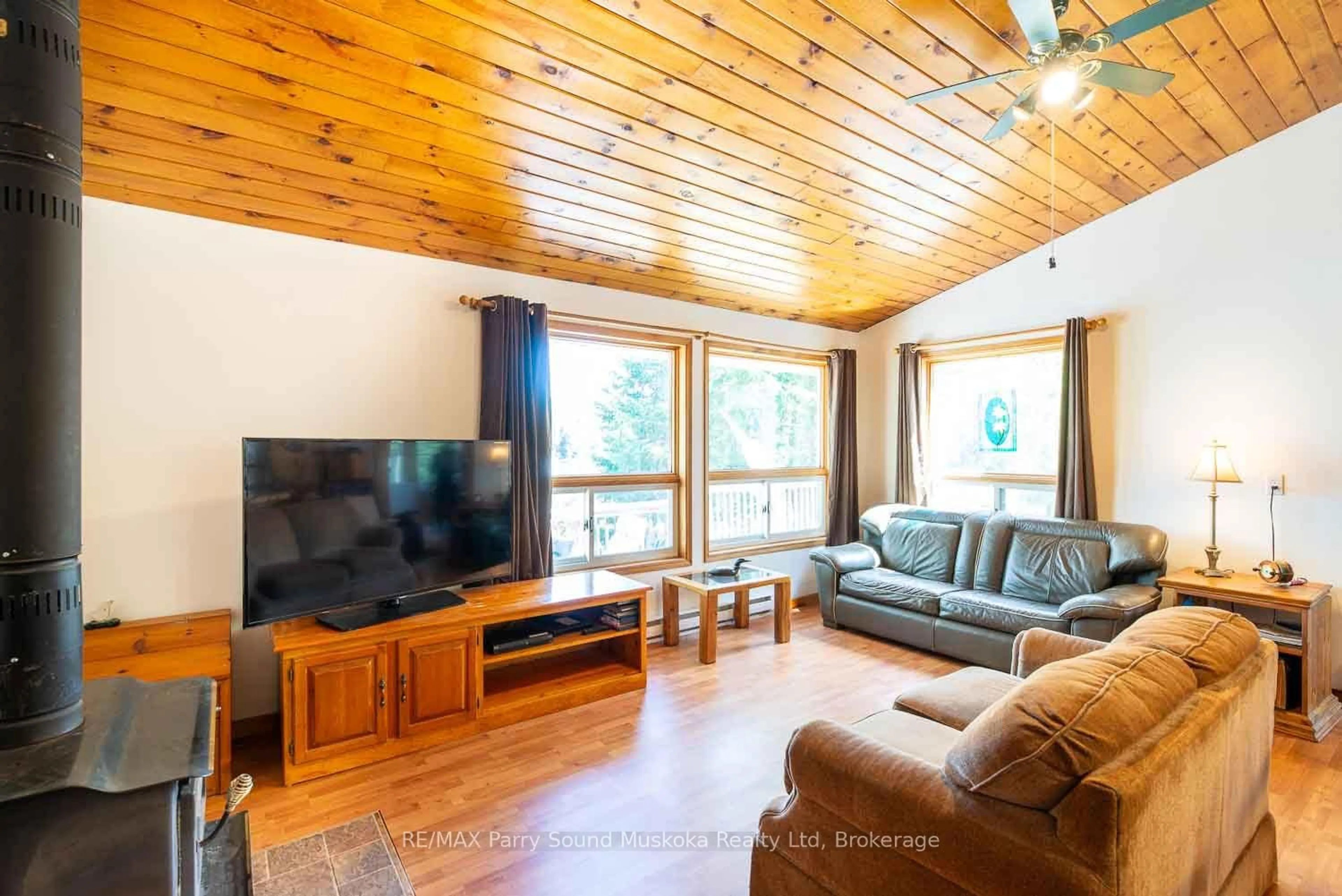 Living room with furniture, wood/laminate floor for 1931 B South Horn Lake Rd, Magnetawan Ontario P0A 1C0