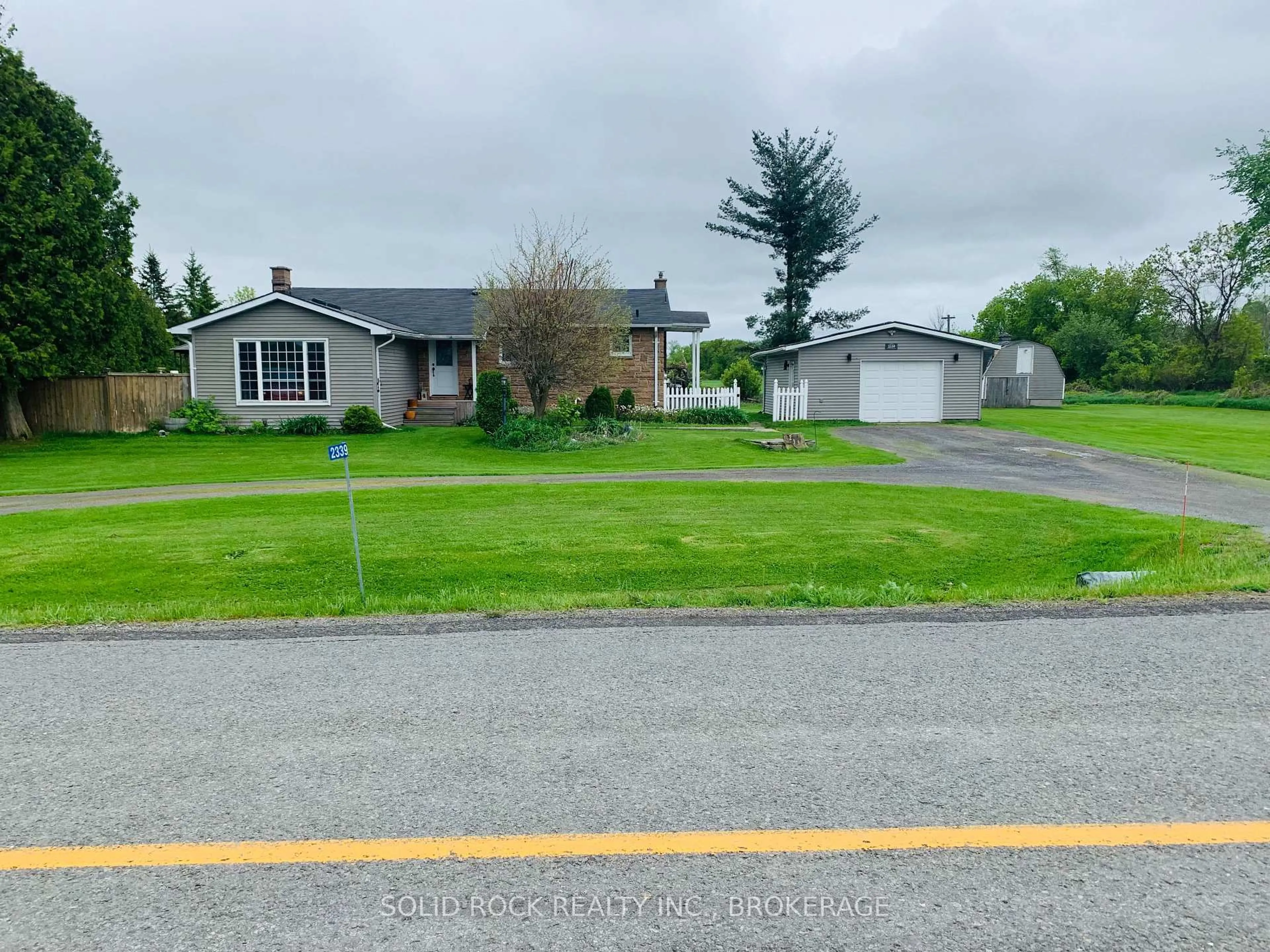 A pic from outside/outdoor area/front of a property/back of a property/a pic from drone, street for 2339 Washburn Rd, Inverary Ontario K0H 1X0
