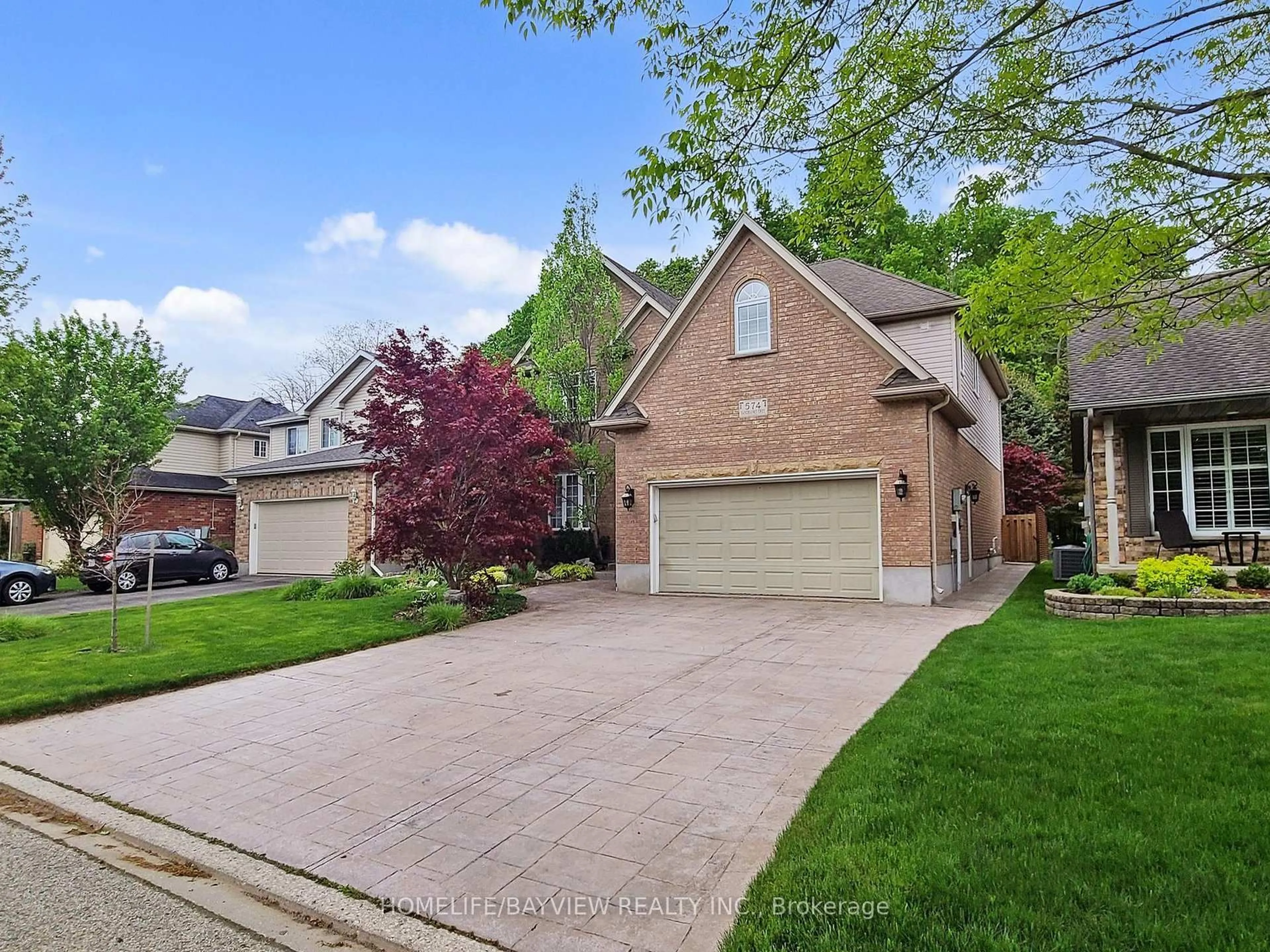 Home with brick exterior material, street for 574 Sandbanks Cres, Waterloo Ontario N2V 2K2